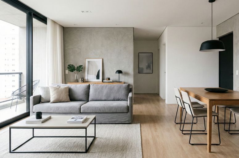 Apartamento com Mesa e sofá no estilo moderno