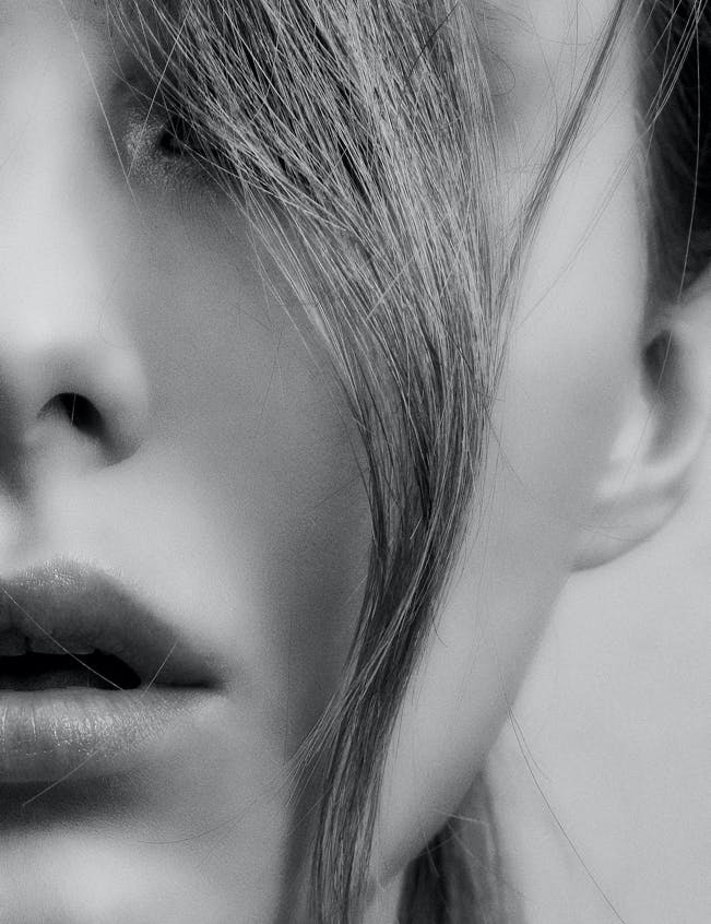 Close up of female face with hair across the front