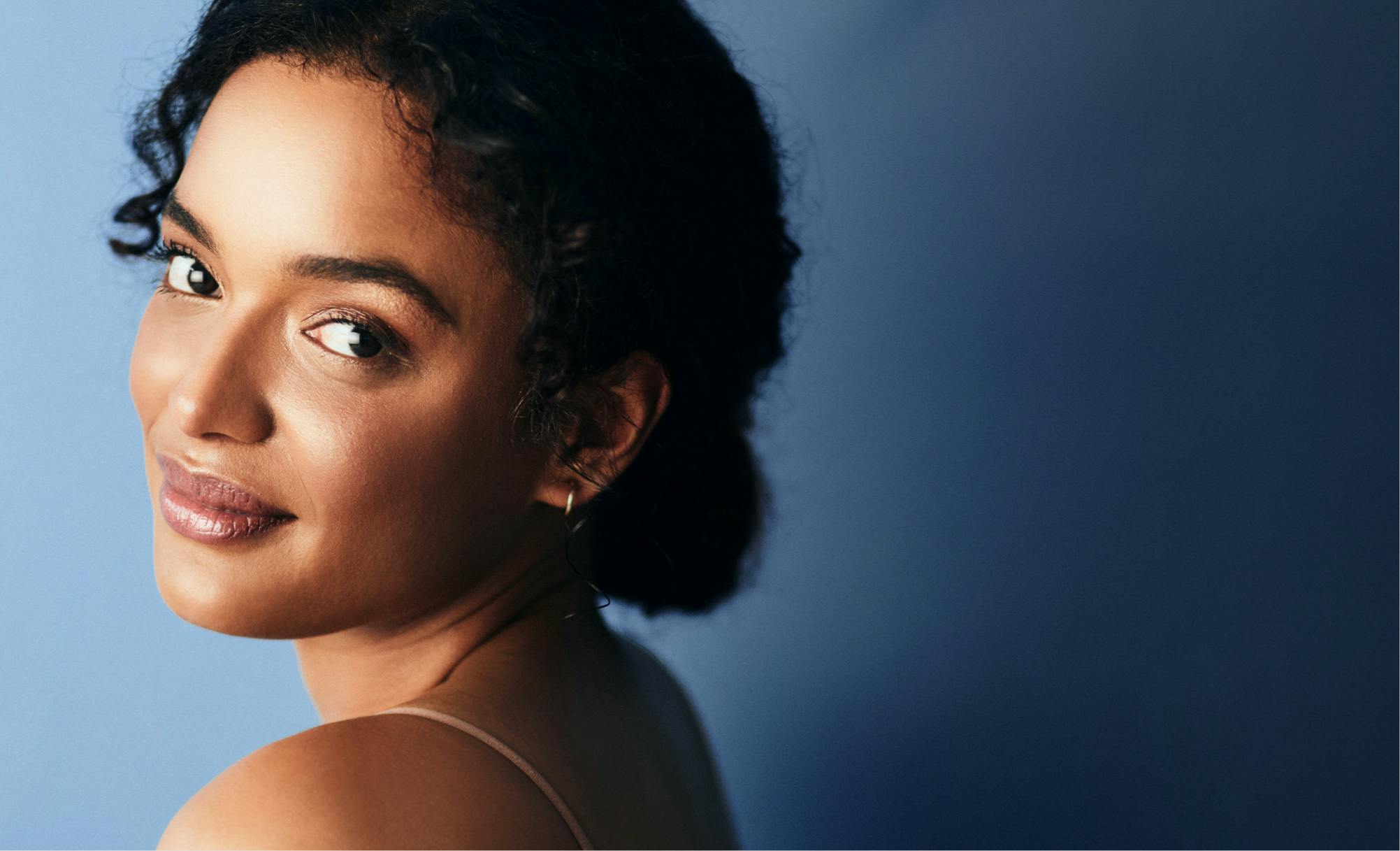 Woman looking over her shoulder.