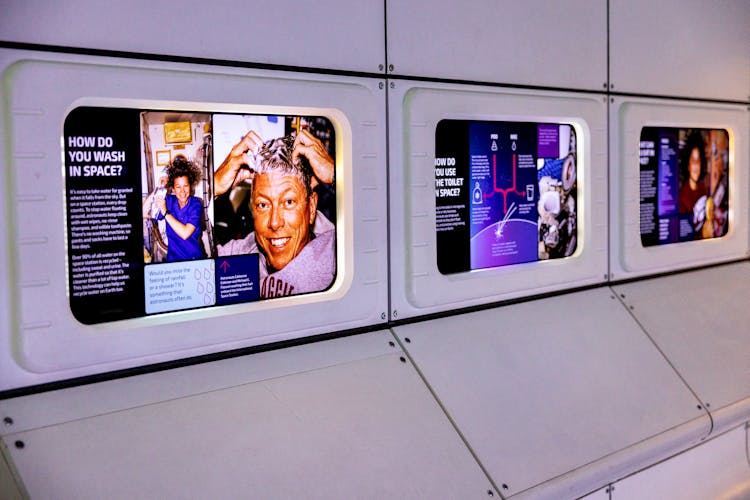 terminal, person, advertisement, electronics, screen, train station