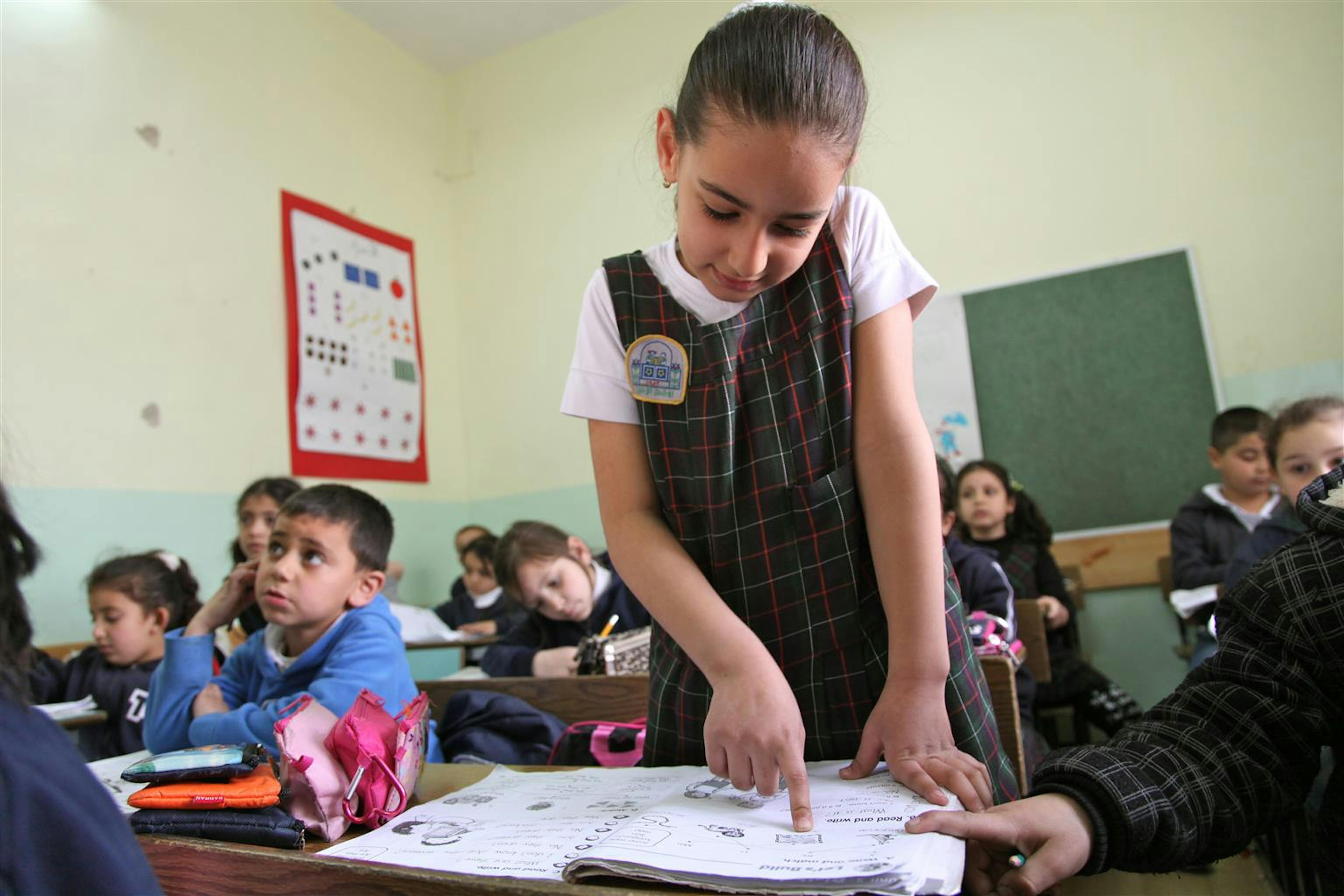 Una bambina palestinese durante una lezione. ©UNICEF/NYHQ2012-0314/Pirozzi