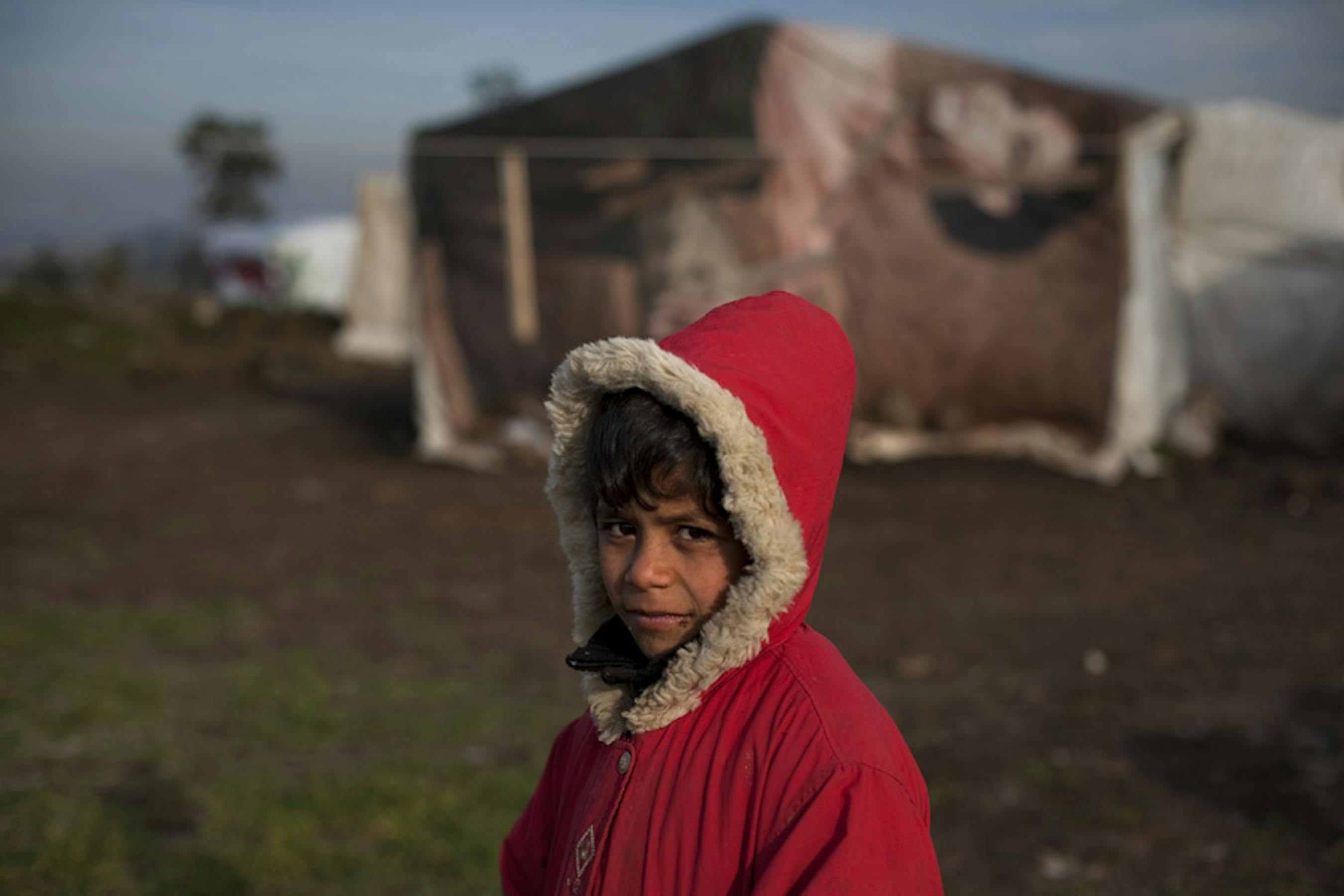 Un bambino siriano in un campo profughi della valle di Akkar, nel nord del Libano - ©UNICEF/NYHQ2013-0040/Marta Ramoneda