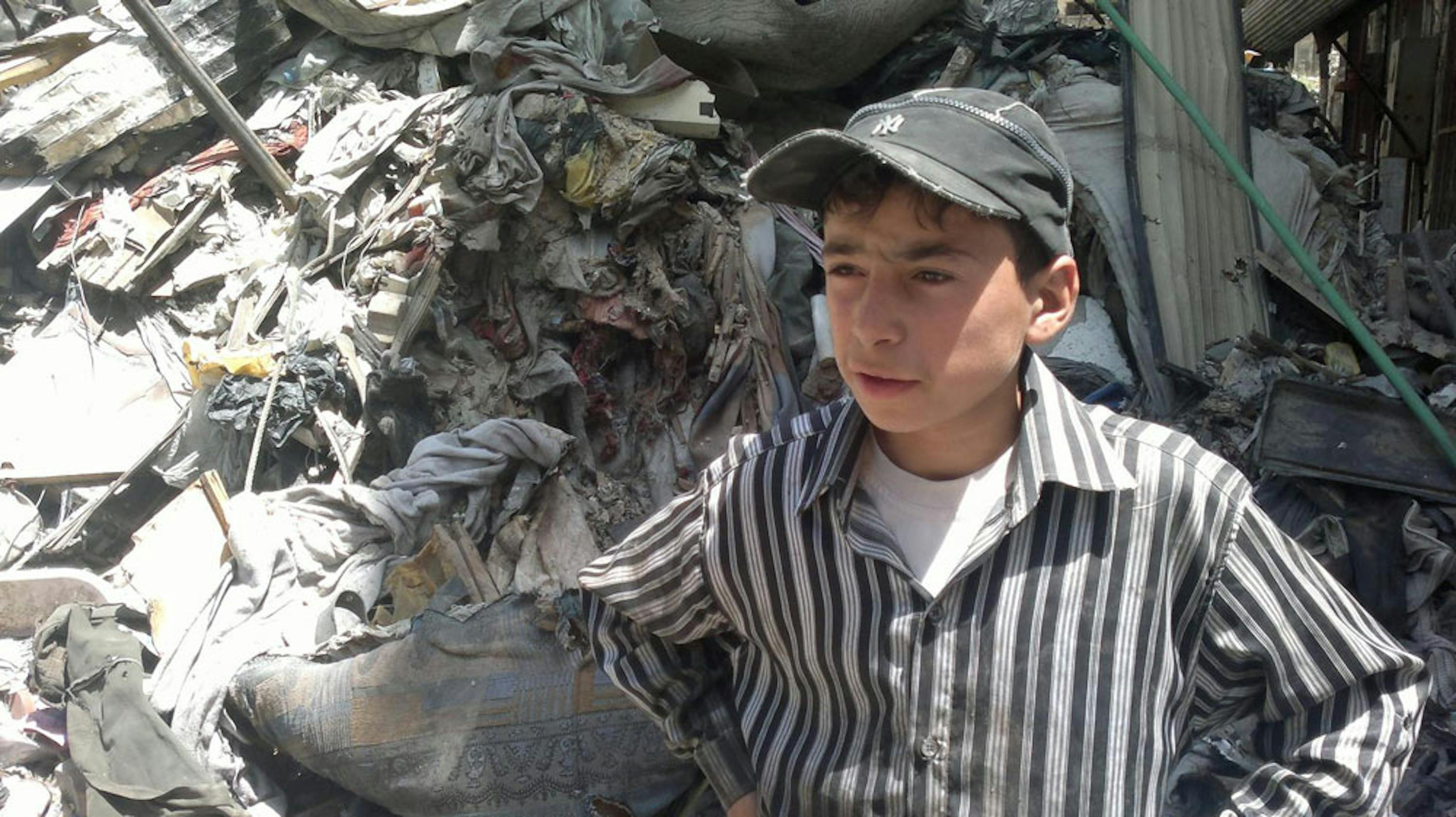 Un bambino di 13 anni fra le macerie della Città vecchia di Homs, sottoposta a 600 giorni di combattimenti - ©UNICEF/NYHQ2014-0817/Ali