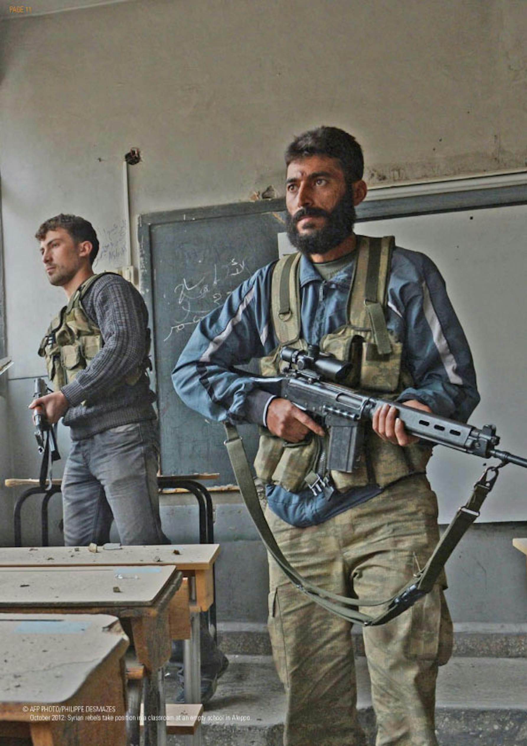 Ribelli prendono posizione in una scuola di Aleppo (Siria) - ©AFP/2012/Philippe Desmazes