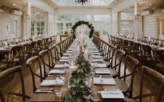 Country wedding reception with rustic foliage