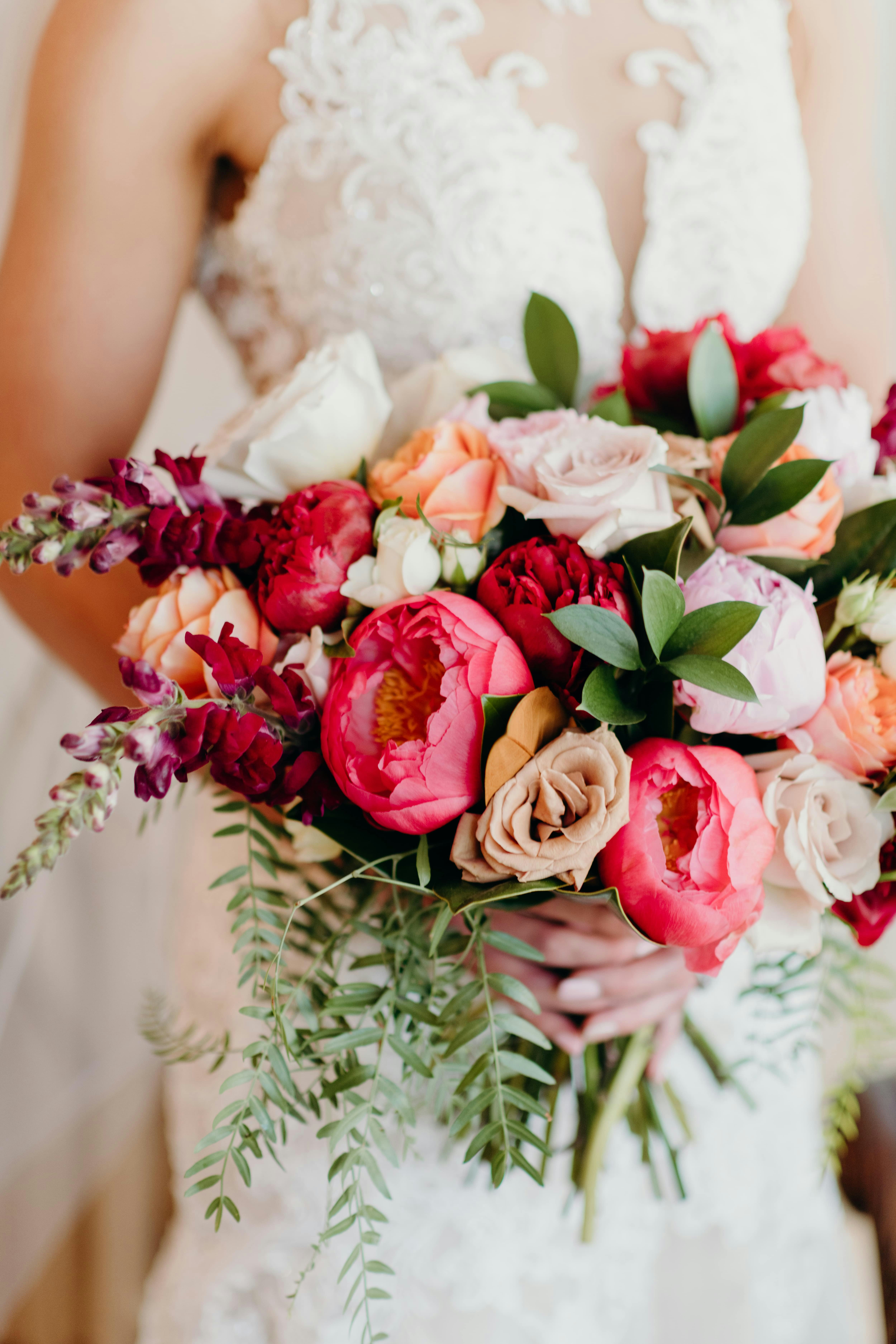 Bride holding a colourful bouquet 