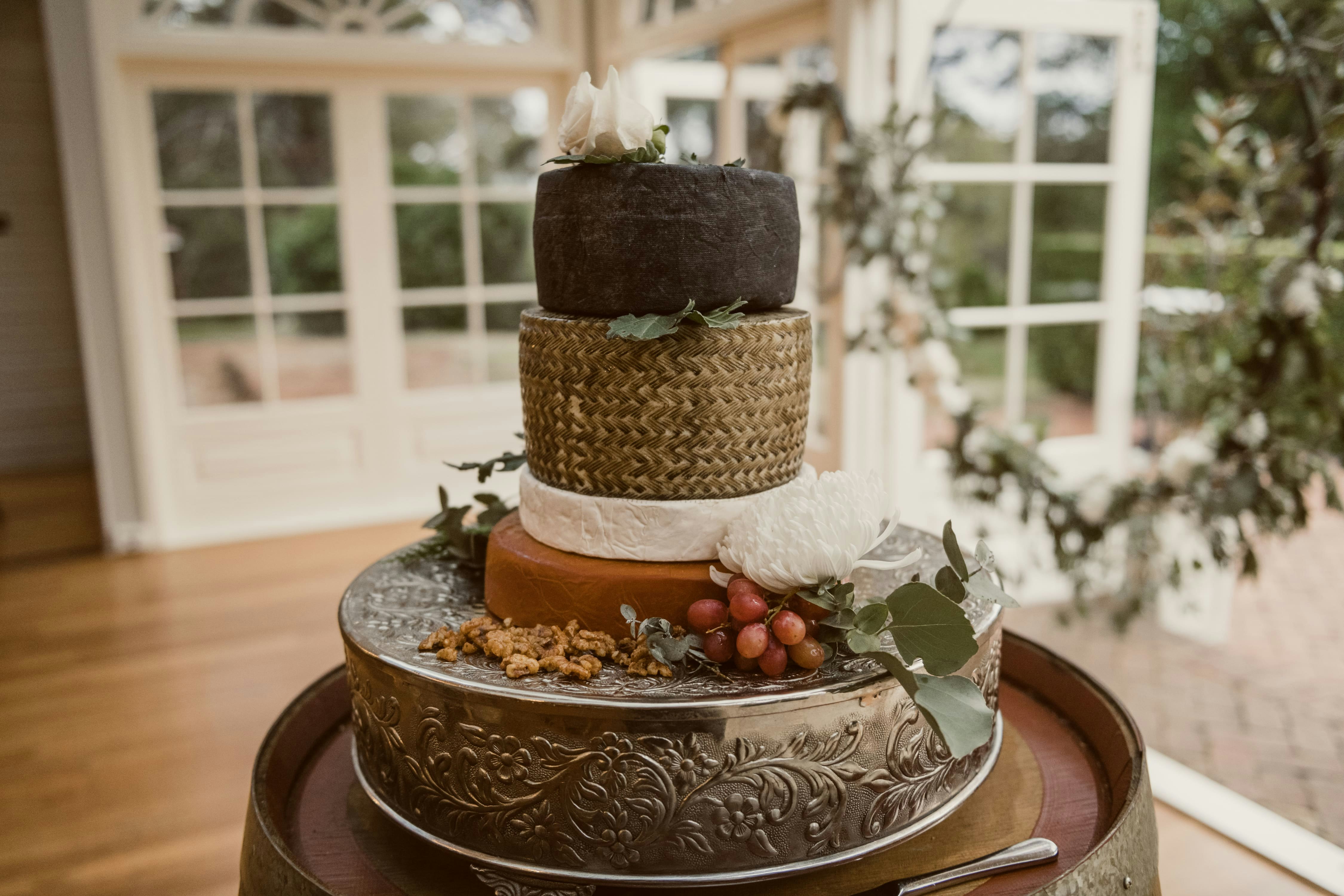 Rounds of cheese stacked on top of one another to make a wedding cake 