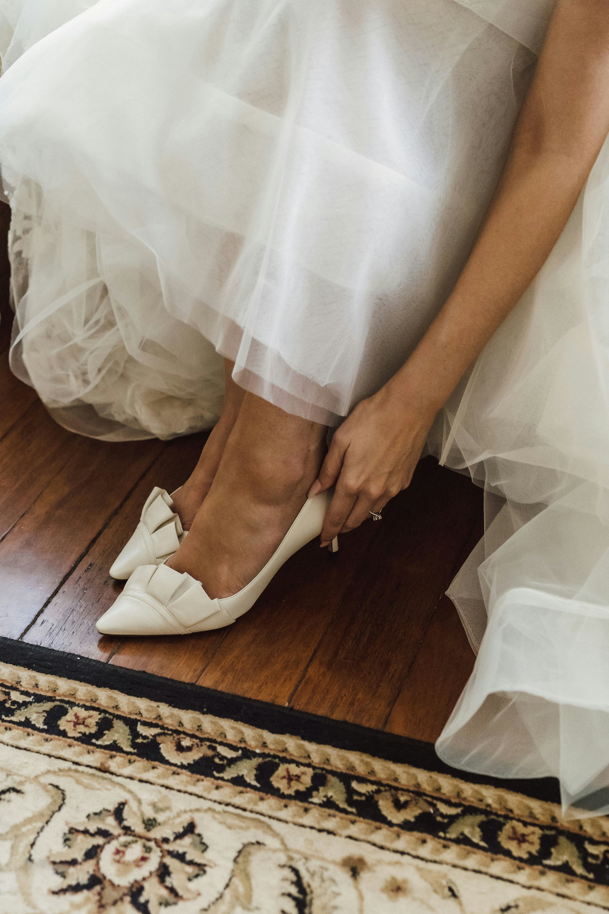 Bride trying on shoes 