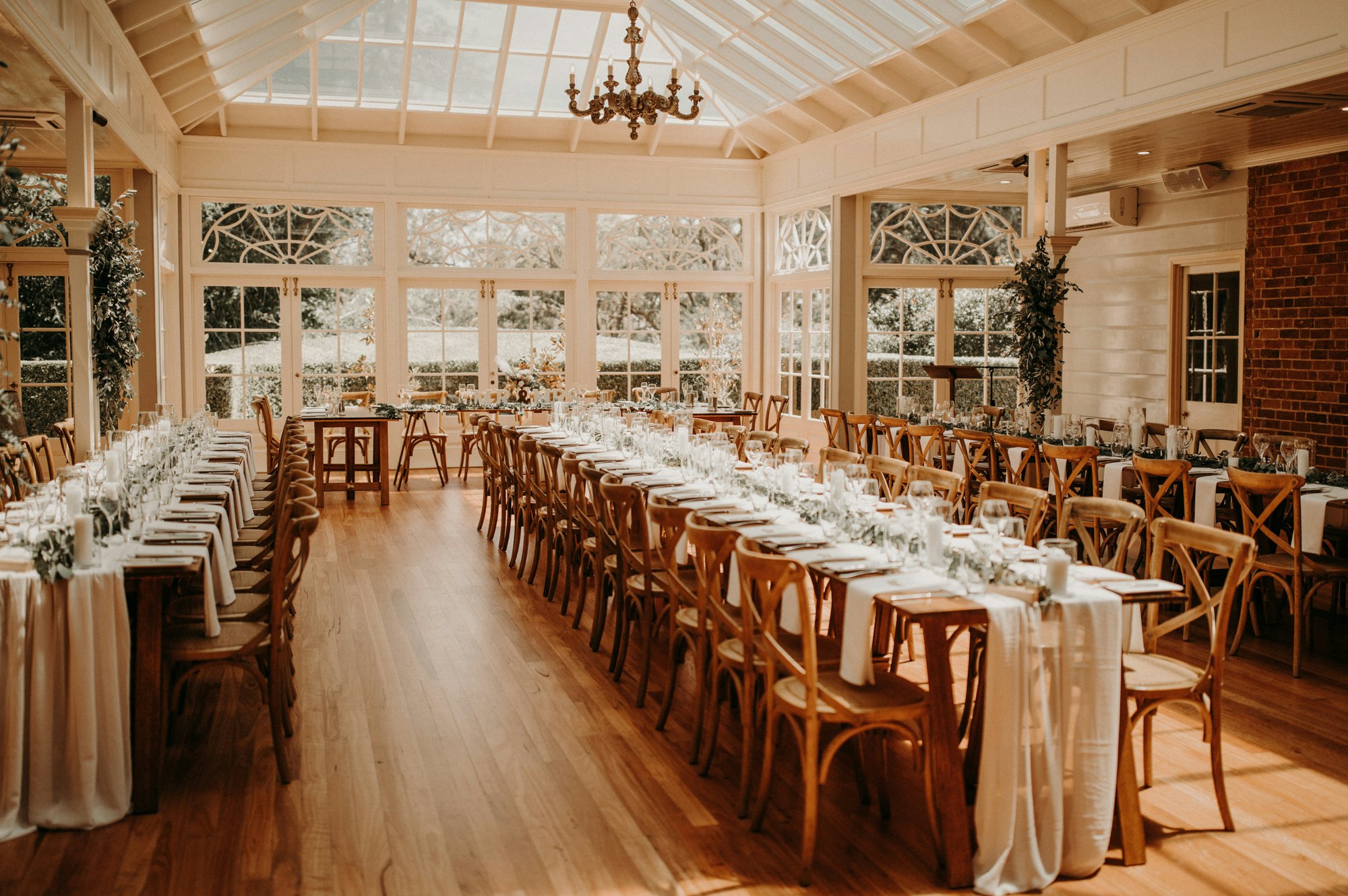 Wedding reception with wooden tables and chairs 