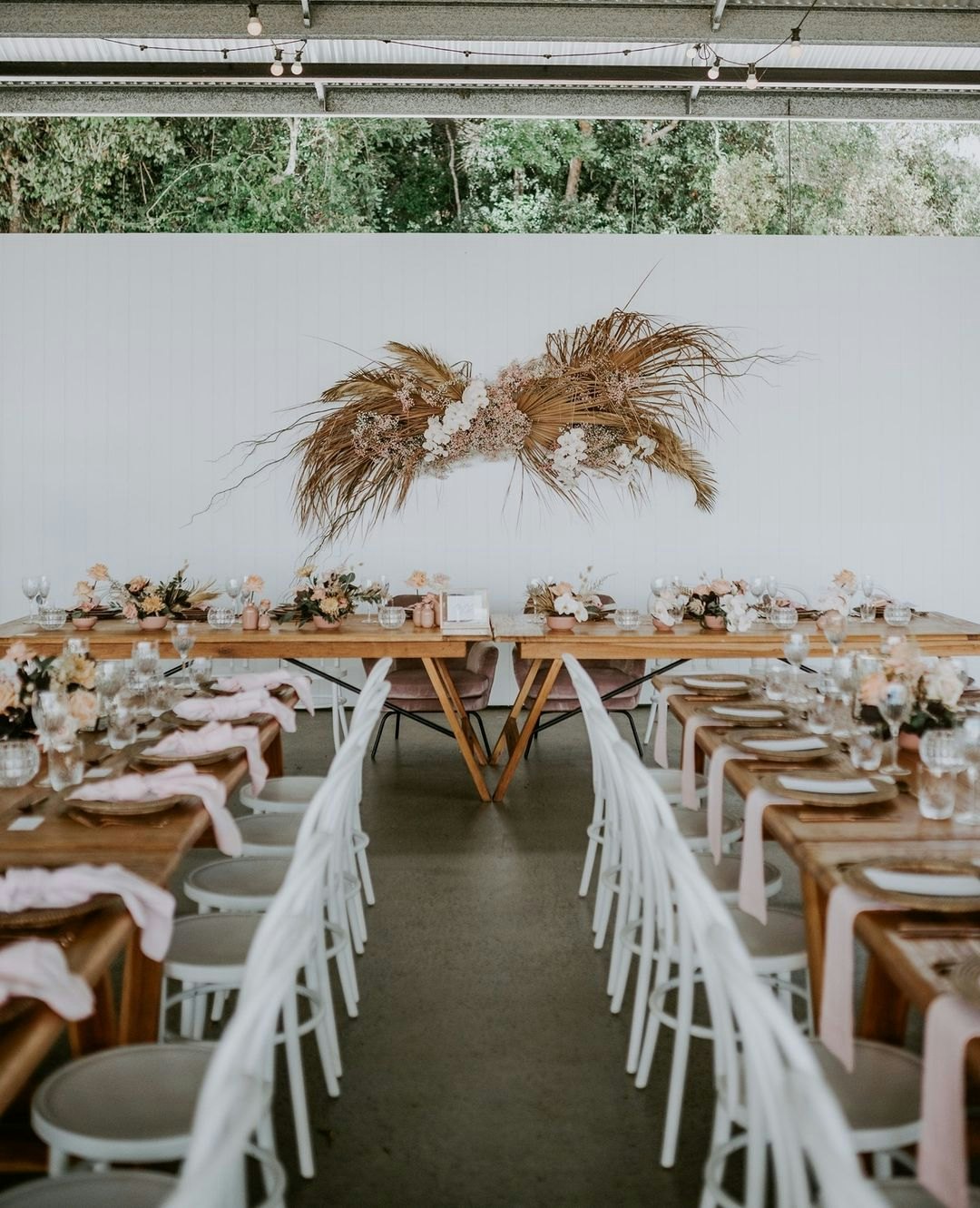 Wedding reception with wooden tables 