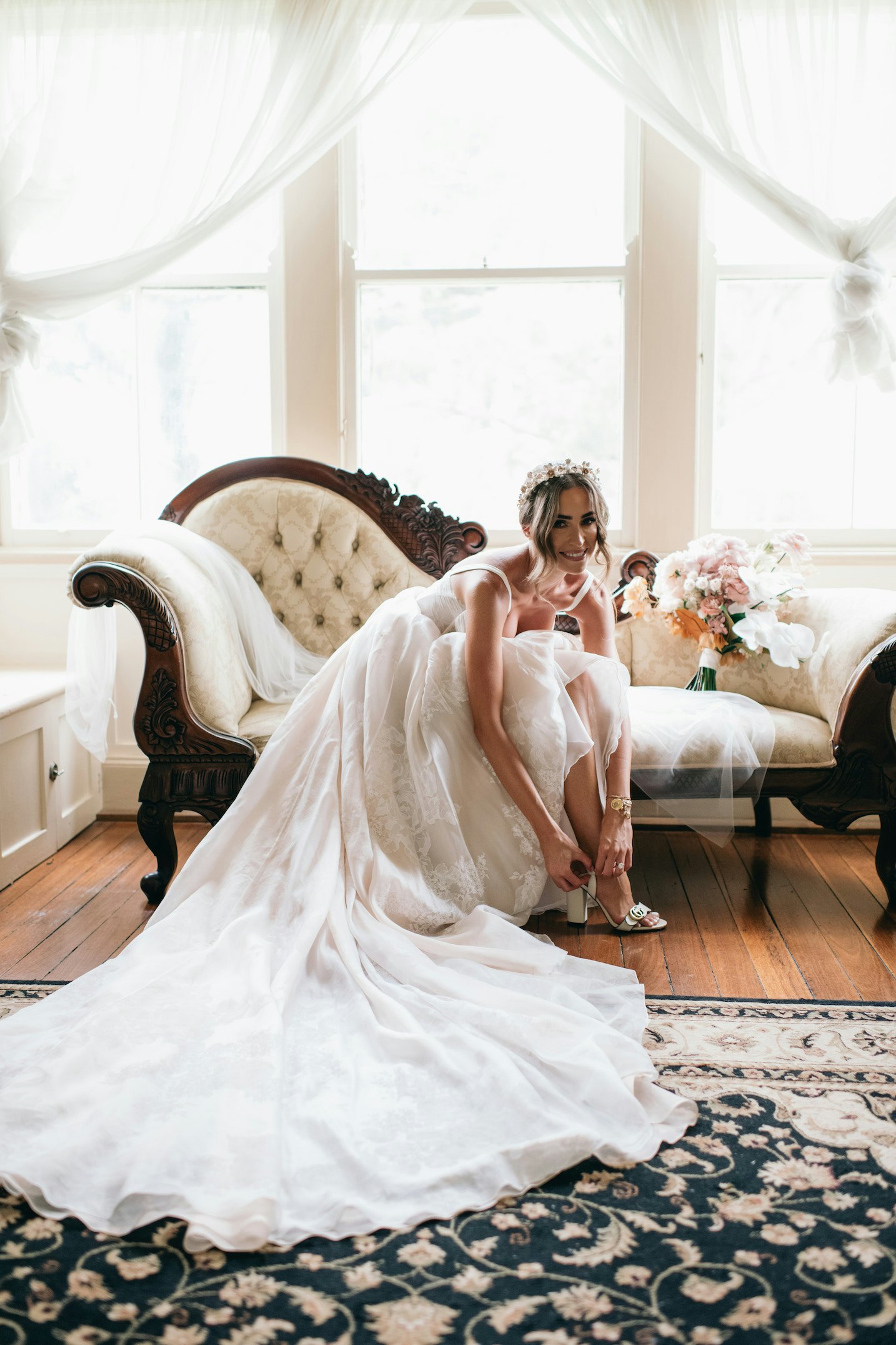 Bride putting on shoes 