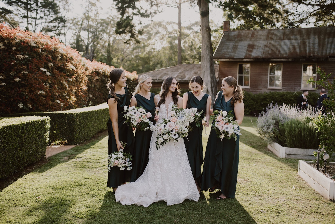 Bride and bridesmaids holding bouquets 