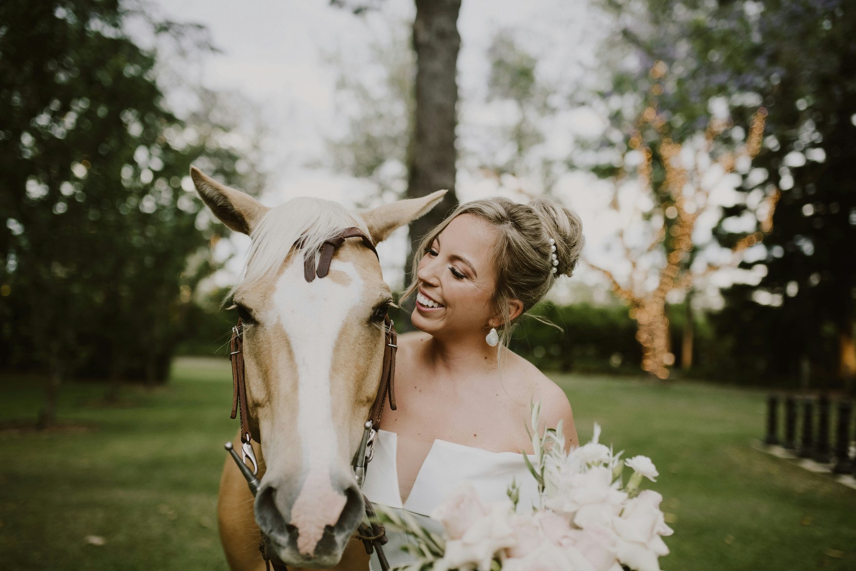Bride petting horse 