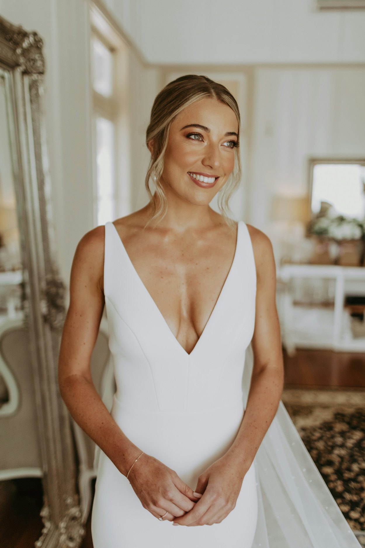 Bride in wedding dress smiling 
