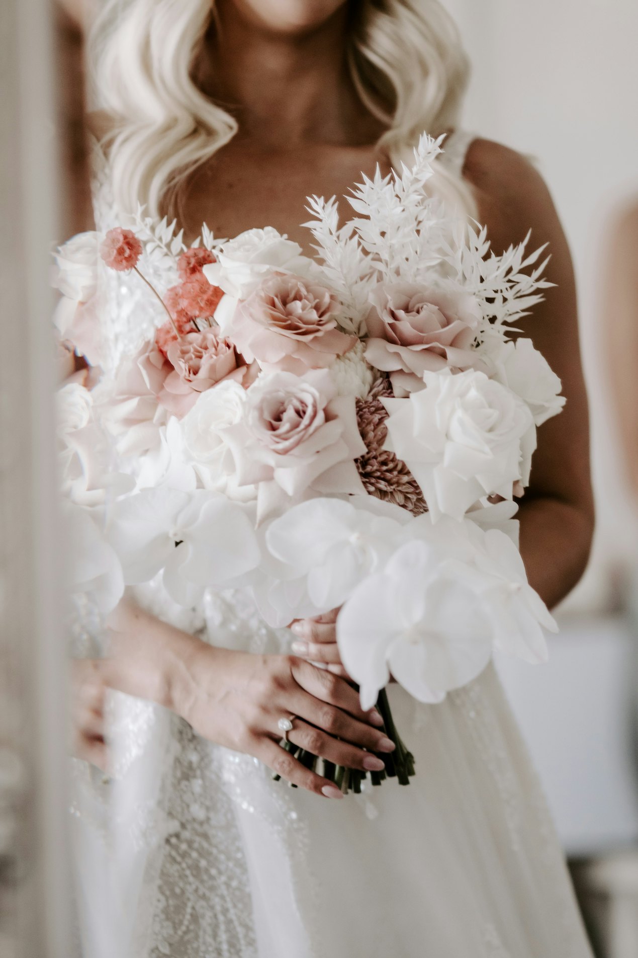 Wedding bouquet with pink roses and white lilies 