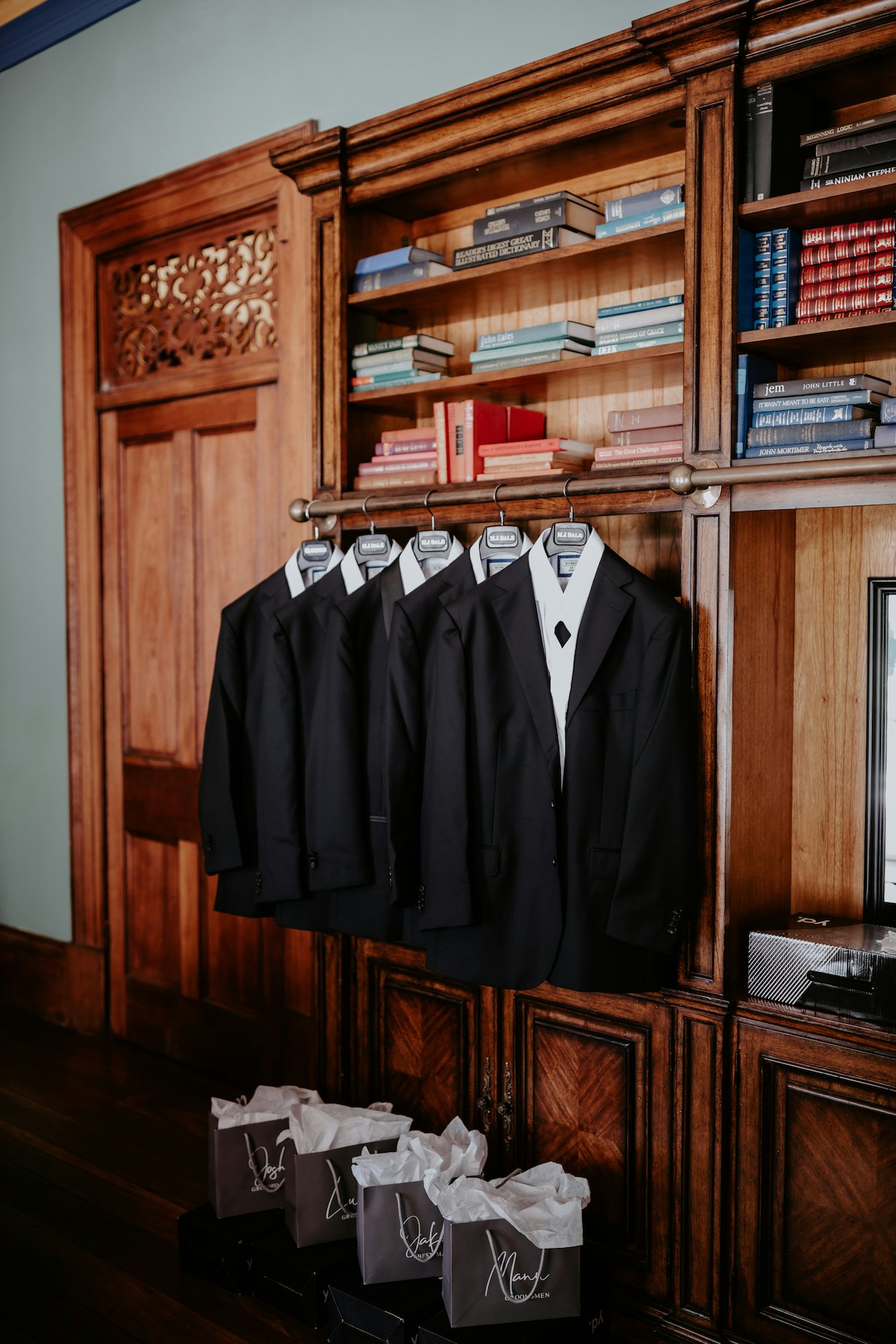 Suits hanging in library 