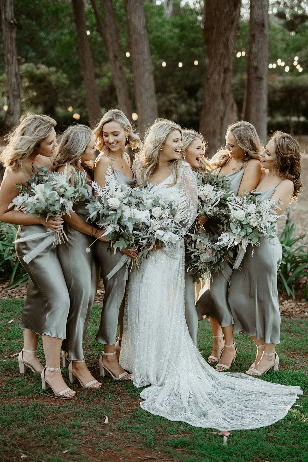 Bride and bridesmaids laugh