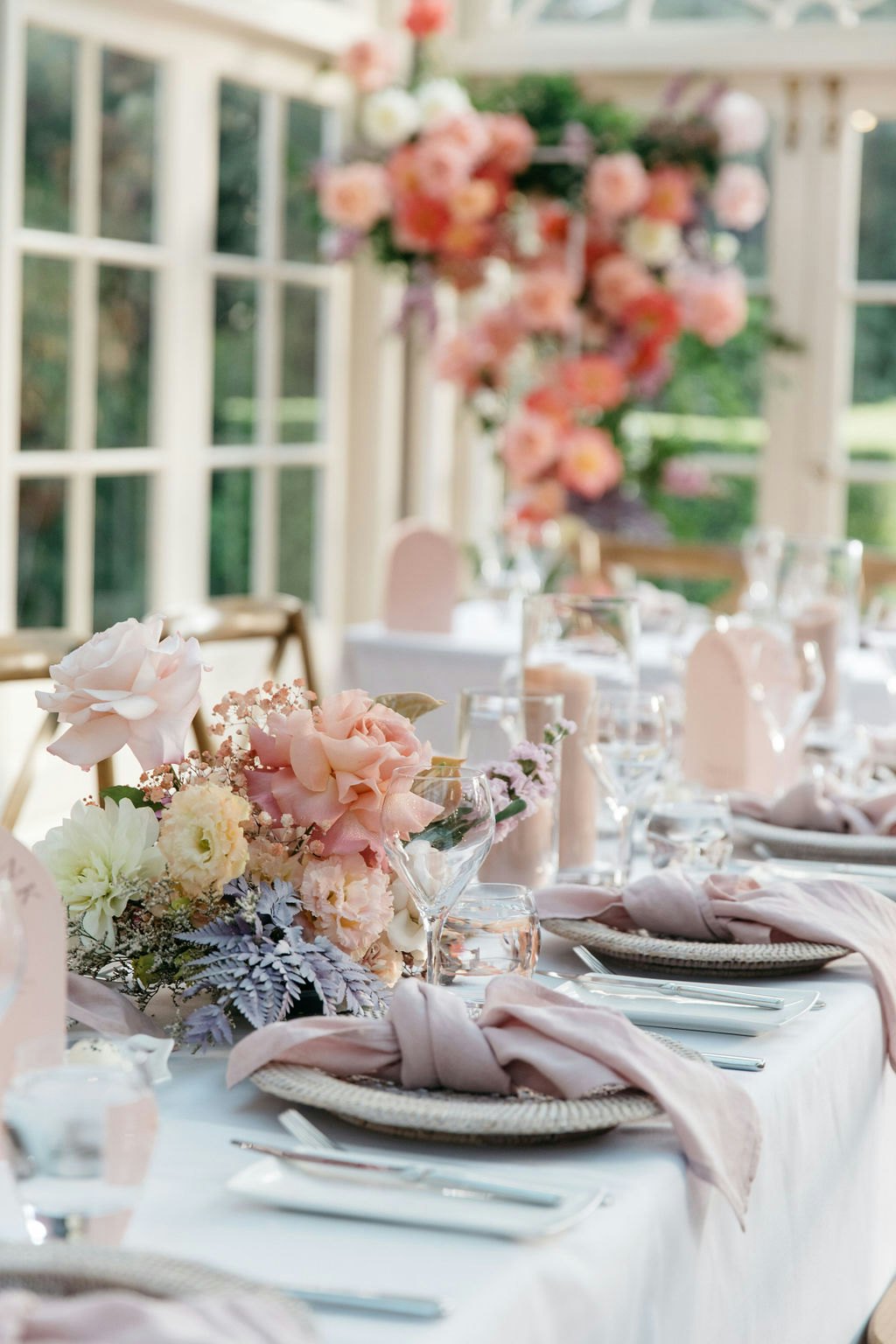 Wedding reception tables with bright flowers 