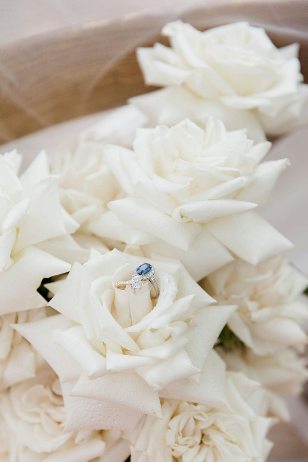 White flower bouquet with wedding ring 