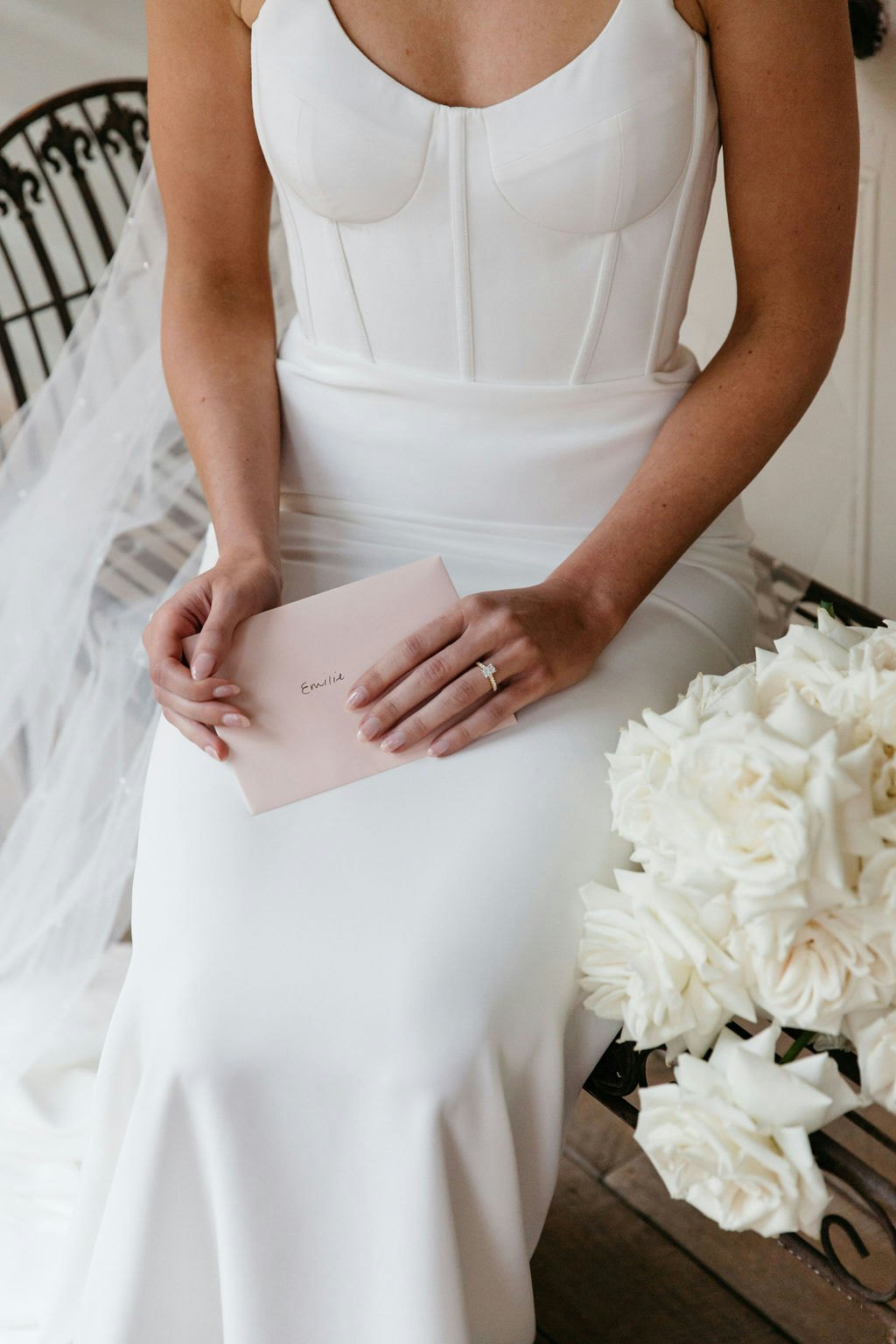 Bride holding a card 