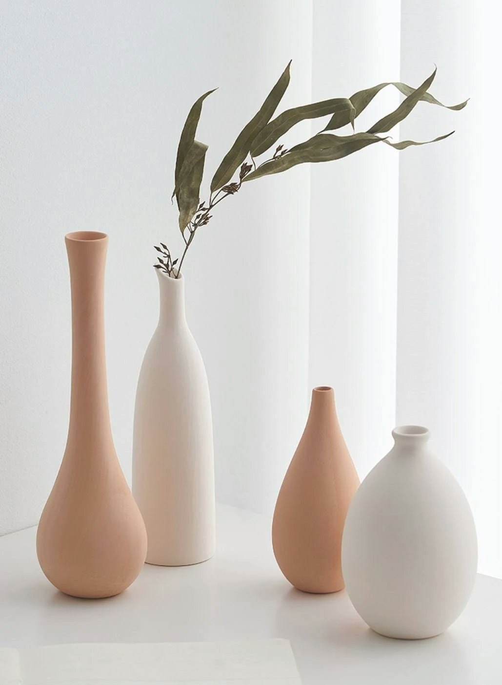 Vases with gumnut leaves 