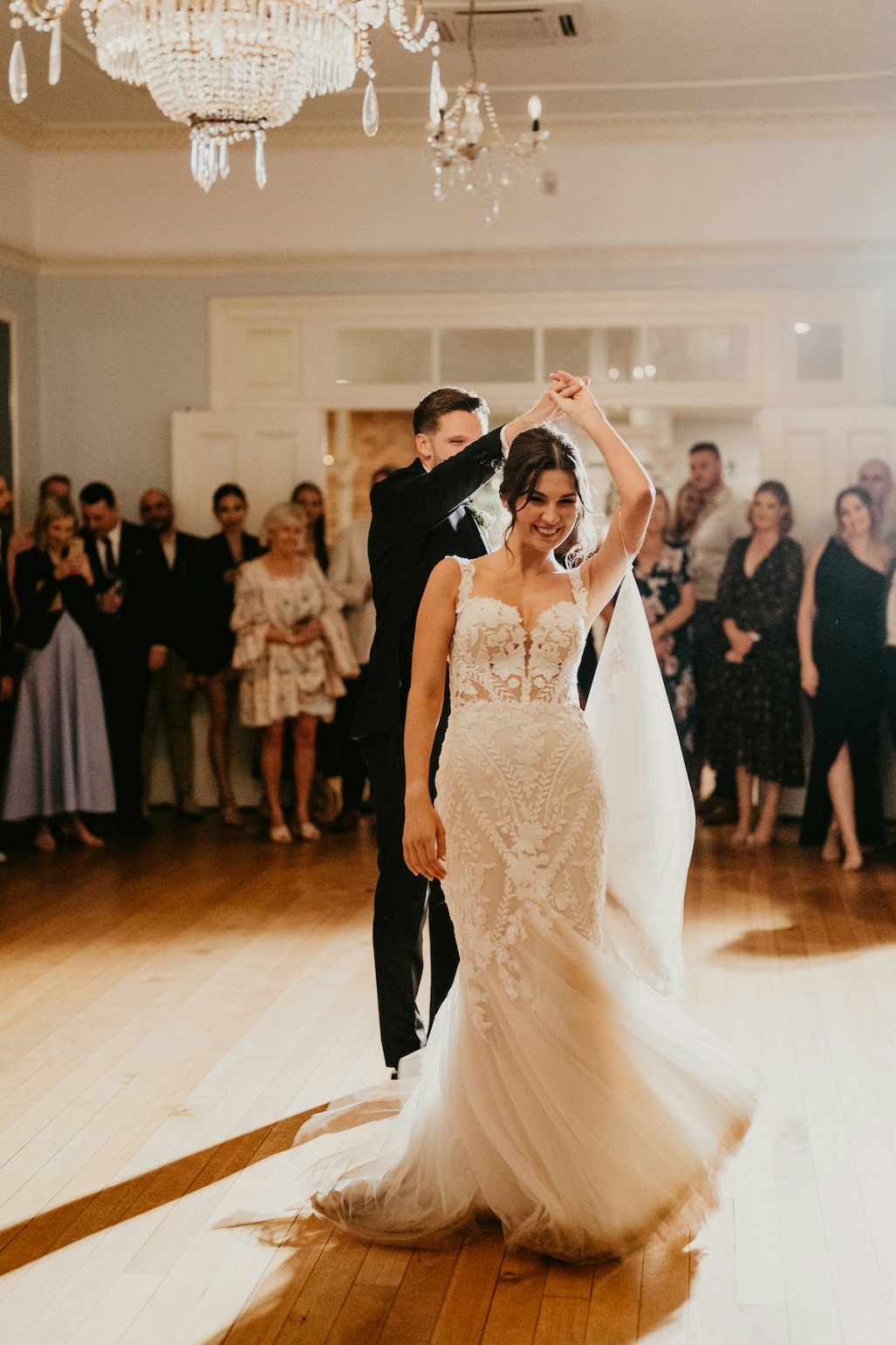 bride and groom dancing in ballroom