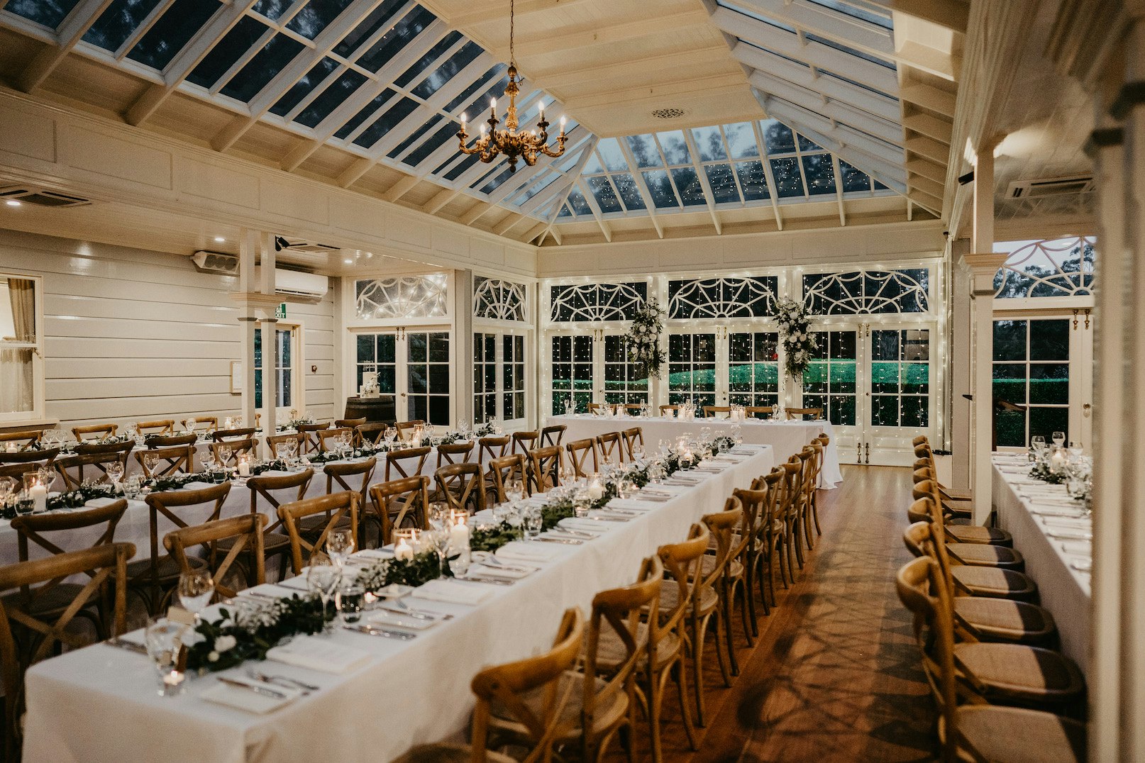 Wedding reception with wooden chairs
