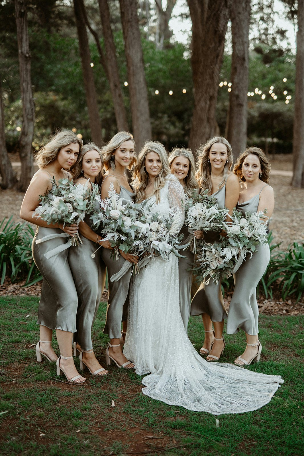 Bride and bridesmaids holding flowers