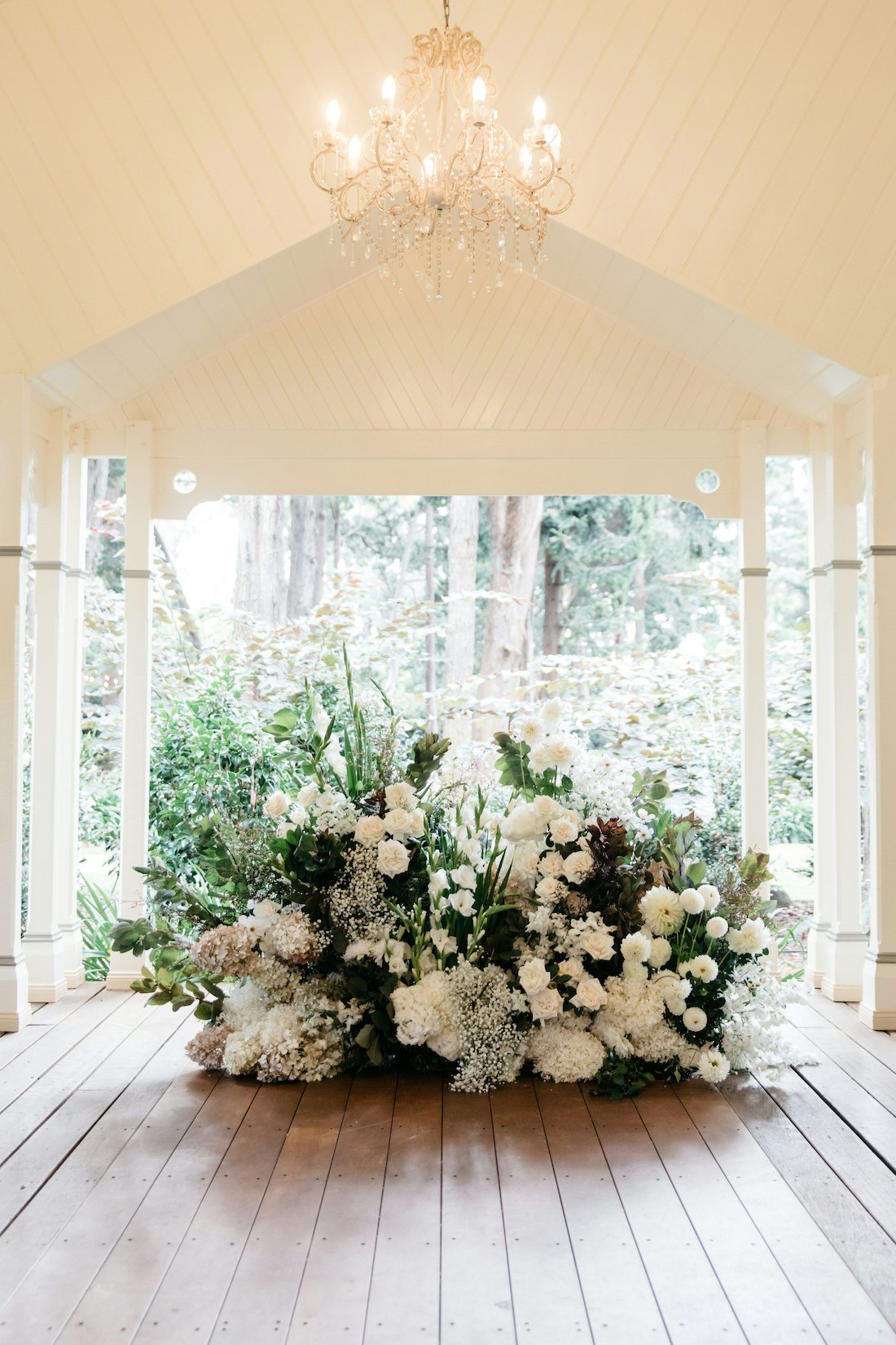 Large floor flower arrangement at wedding ceremony