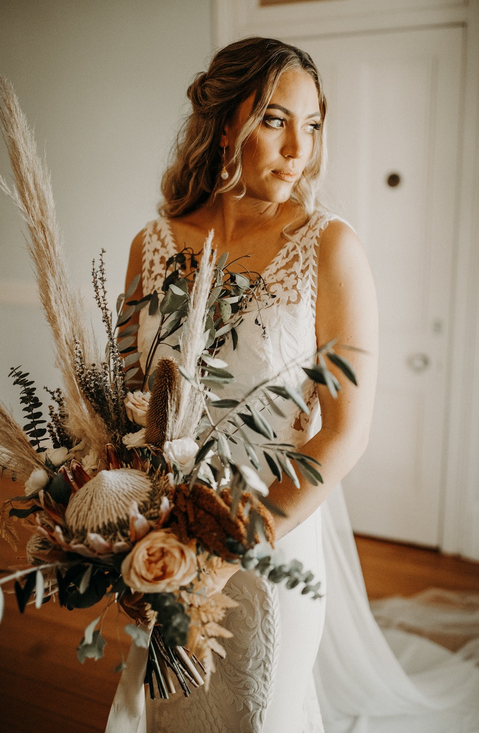 Bride holding dried flower bouquet