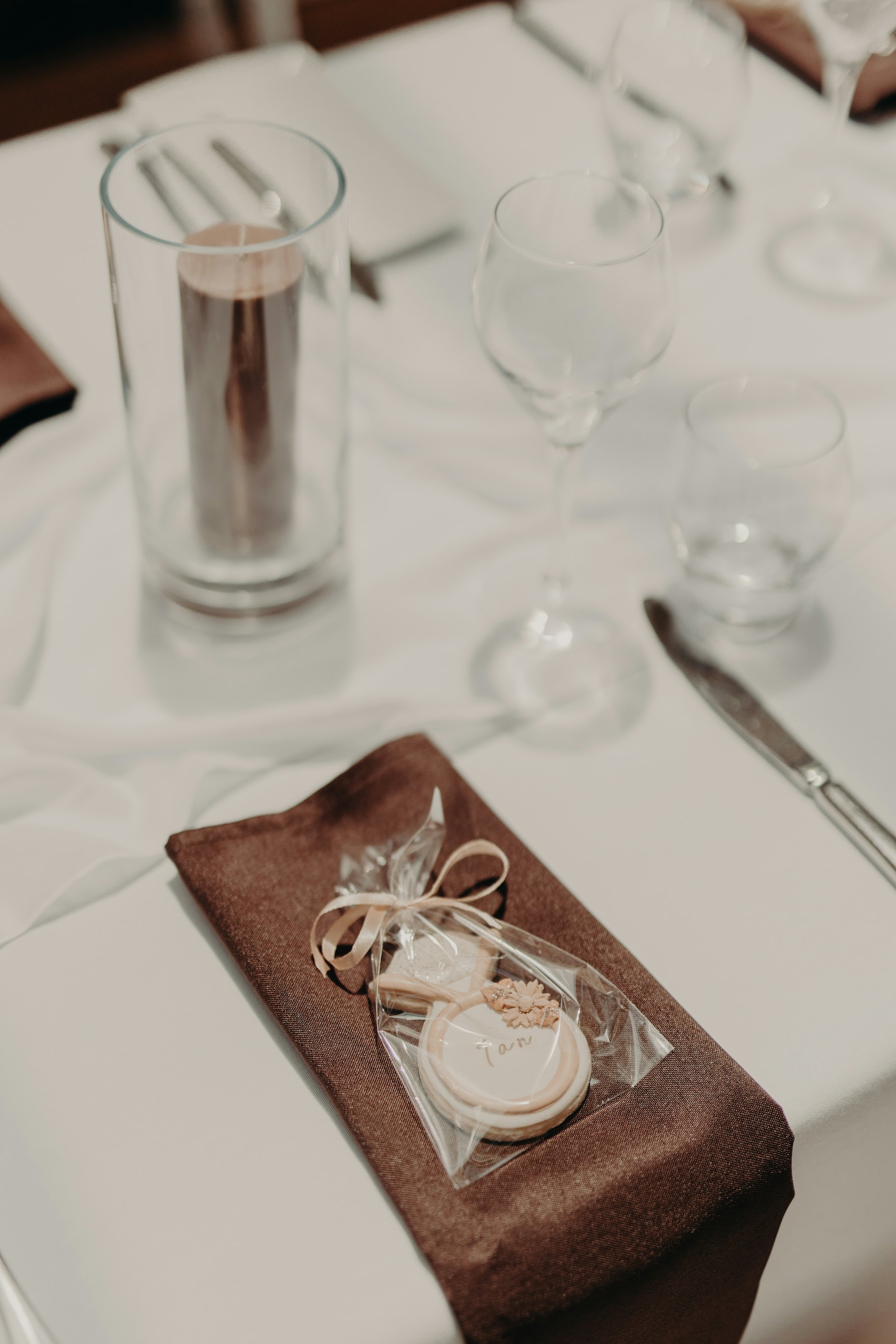 Reception tables with brown linen napkins