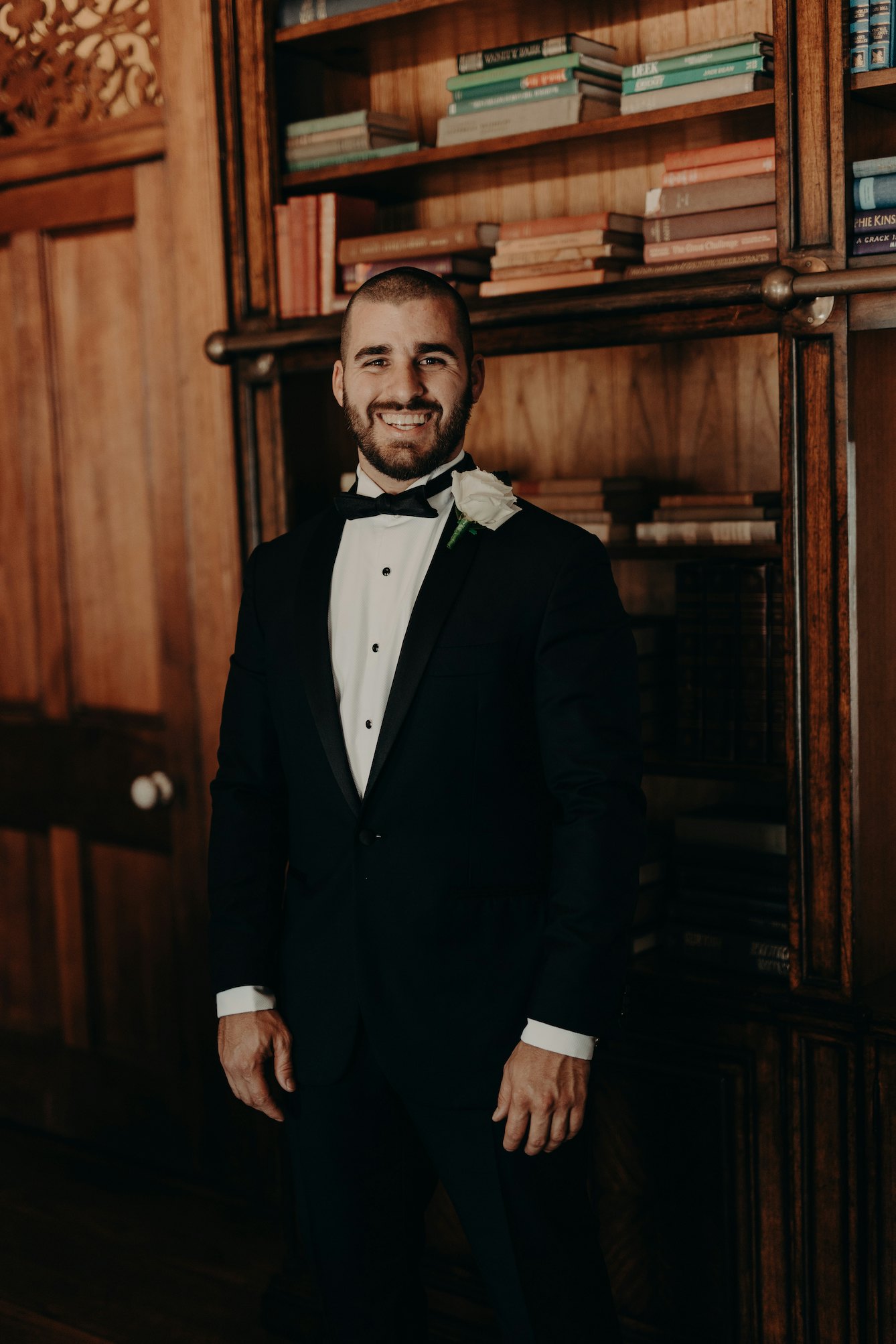 Groom standing in library