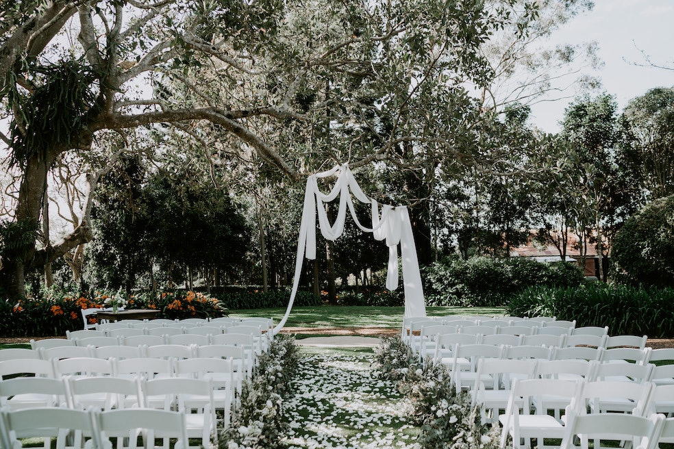 Wedding ceremony with linen in tree branches