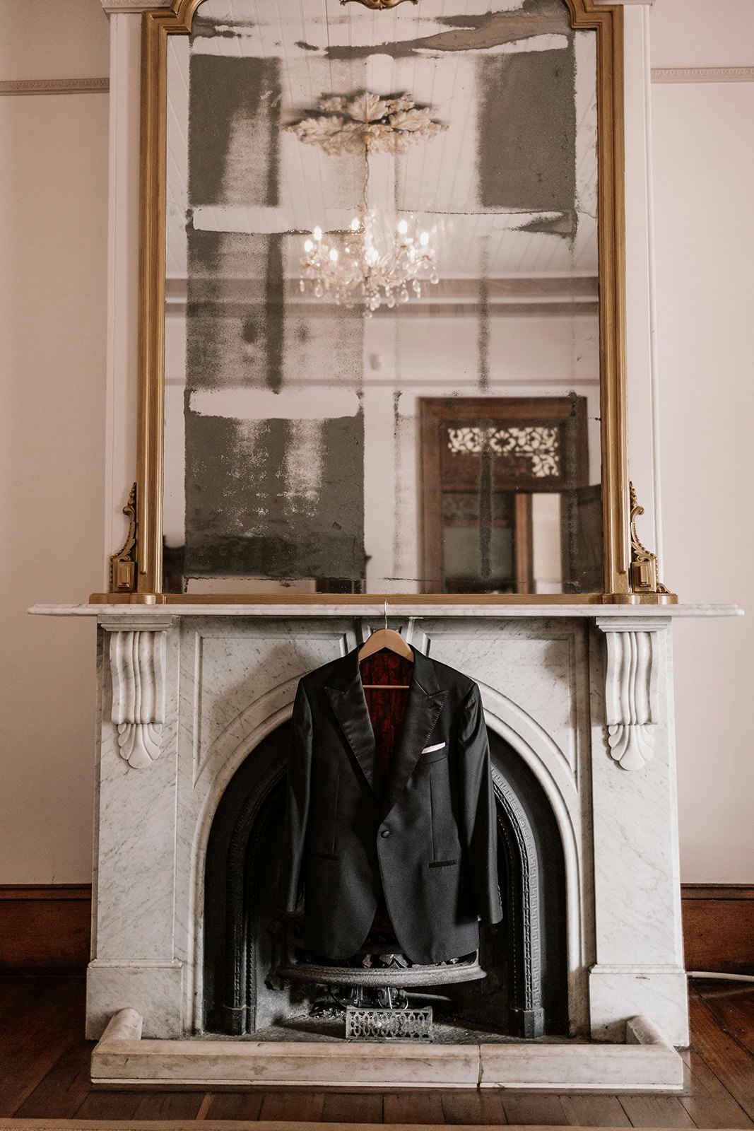 Groom suit jacket hanging in library