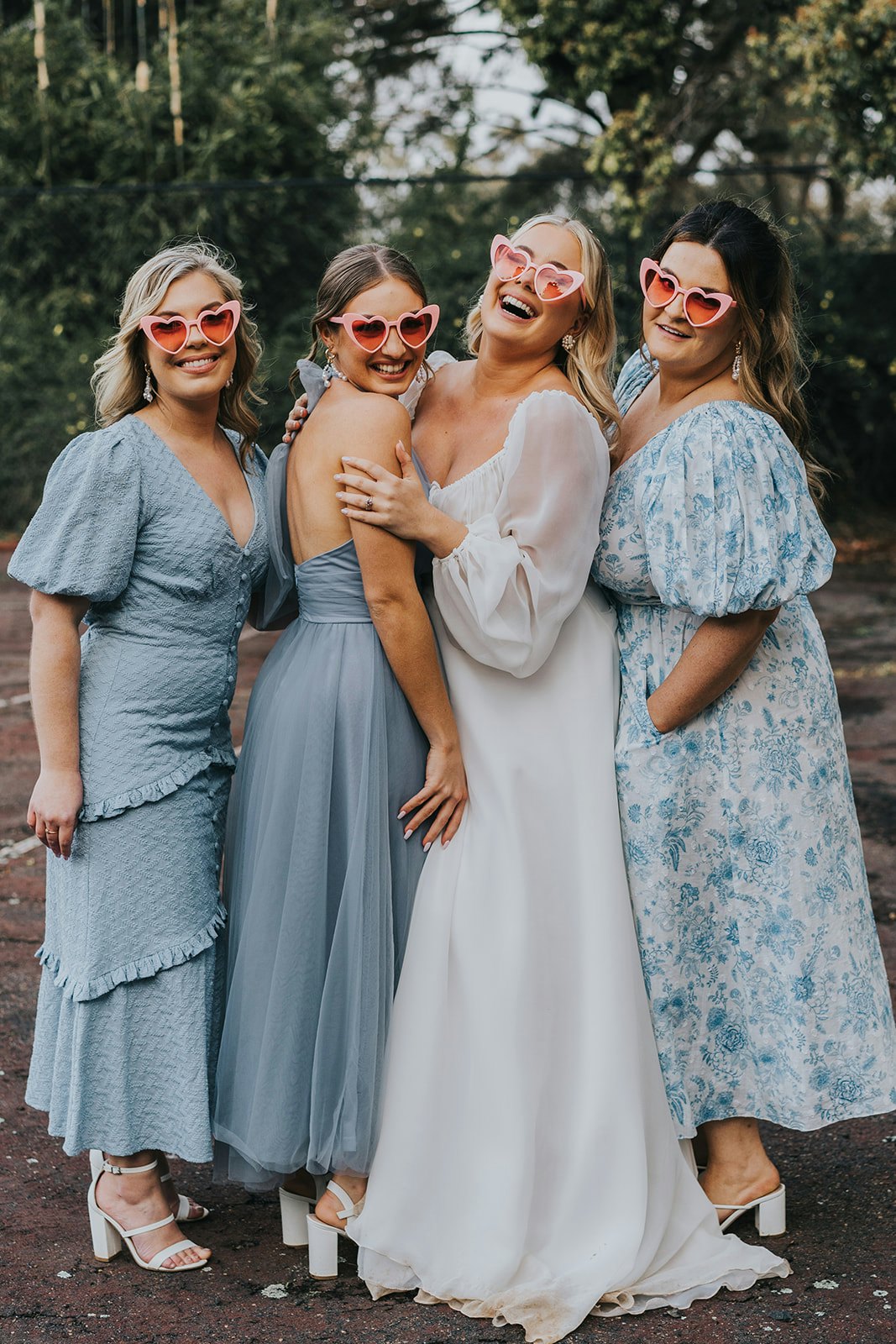 Bride and bridesmaids wearing glasses
