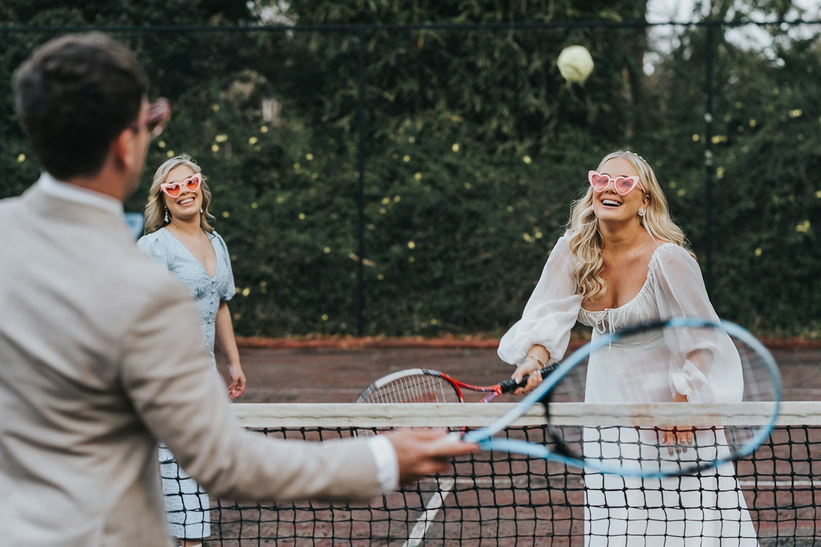 Bride playing tennis