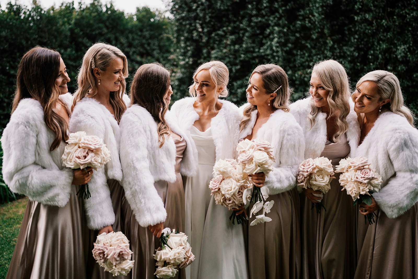 Bride and bridesmaids holding bouquet
