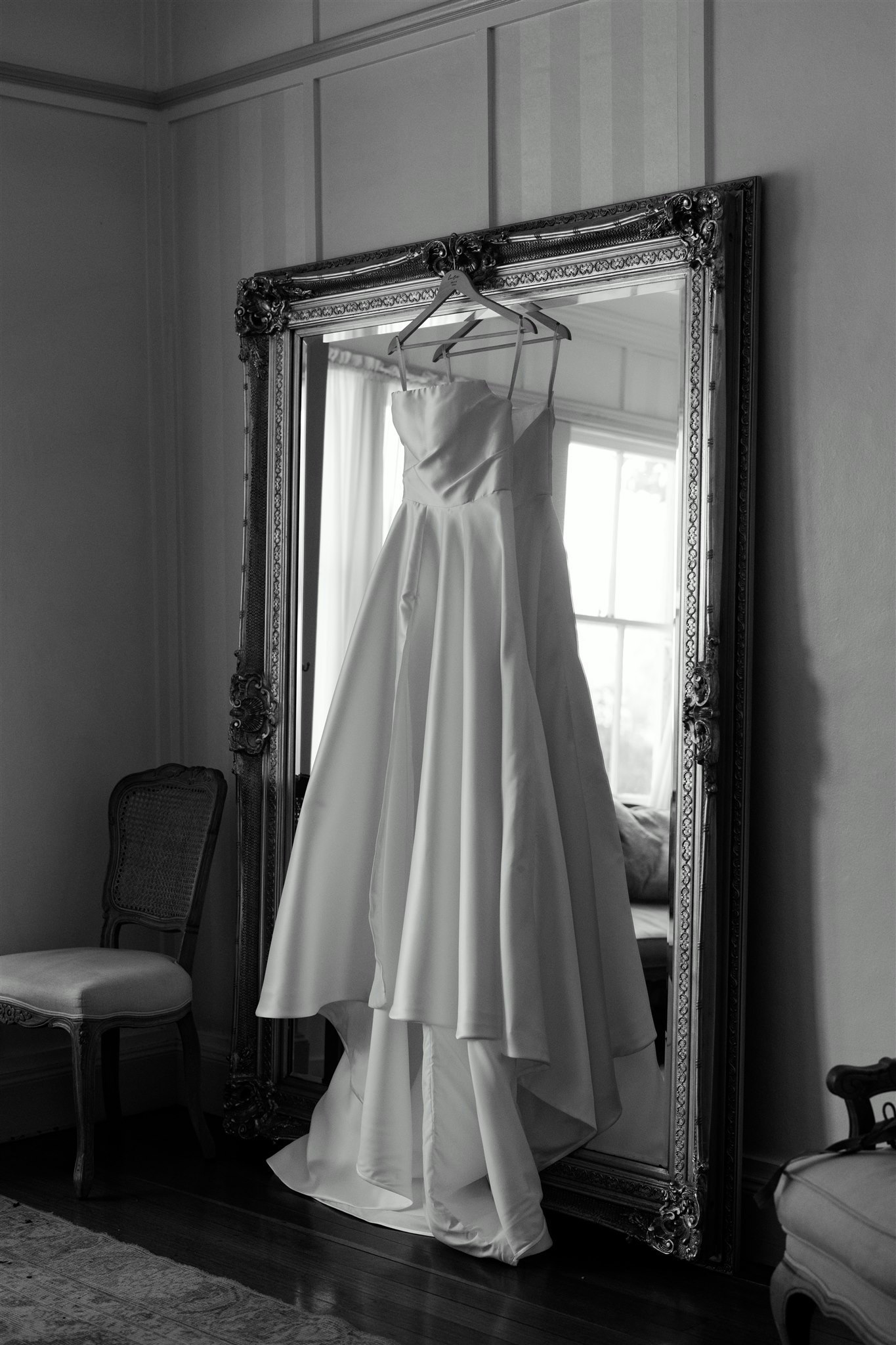 Wedding dress hanging from hanger