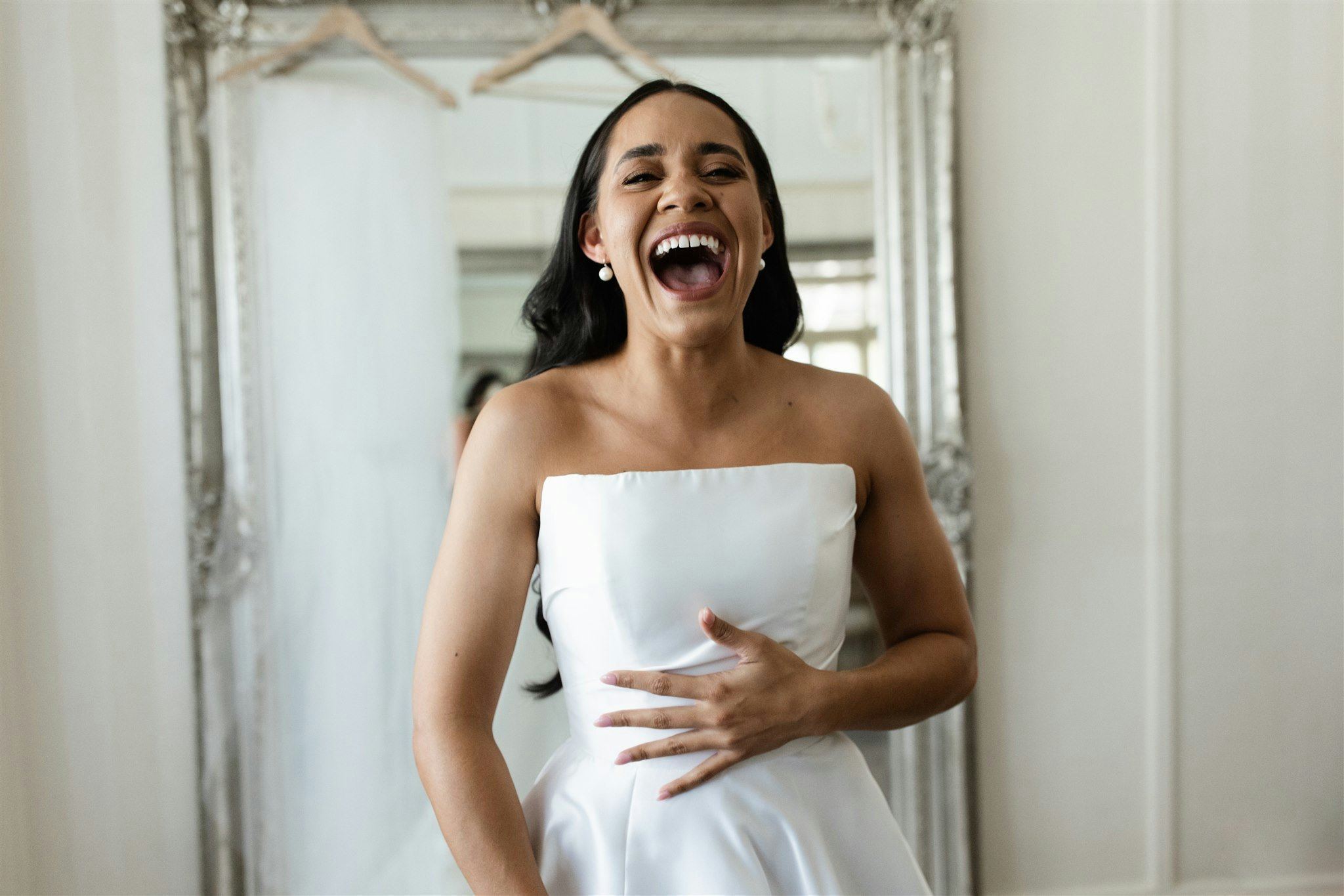 Bride laughing in wedding dress