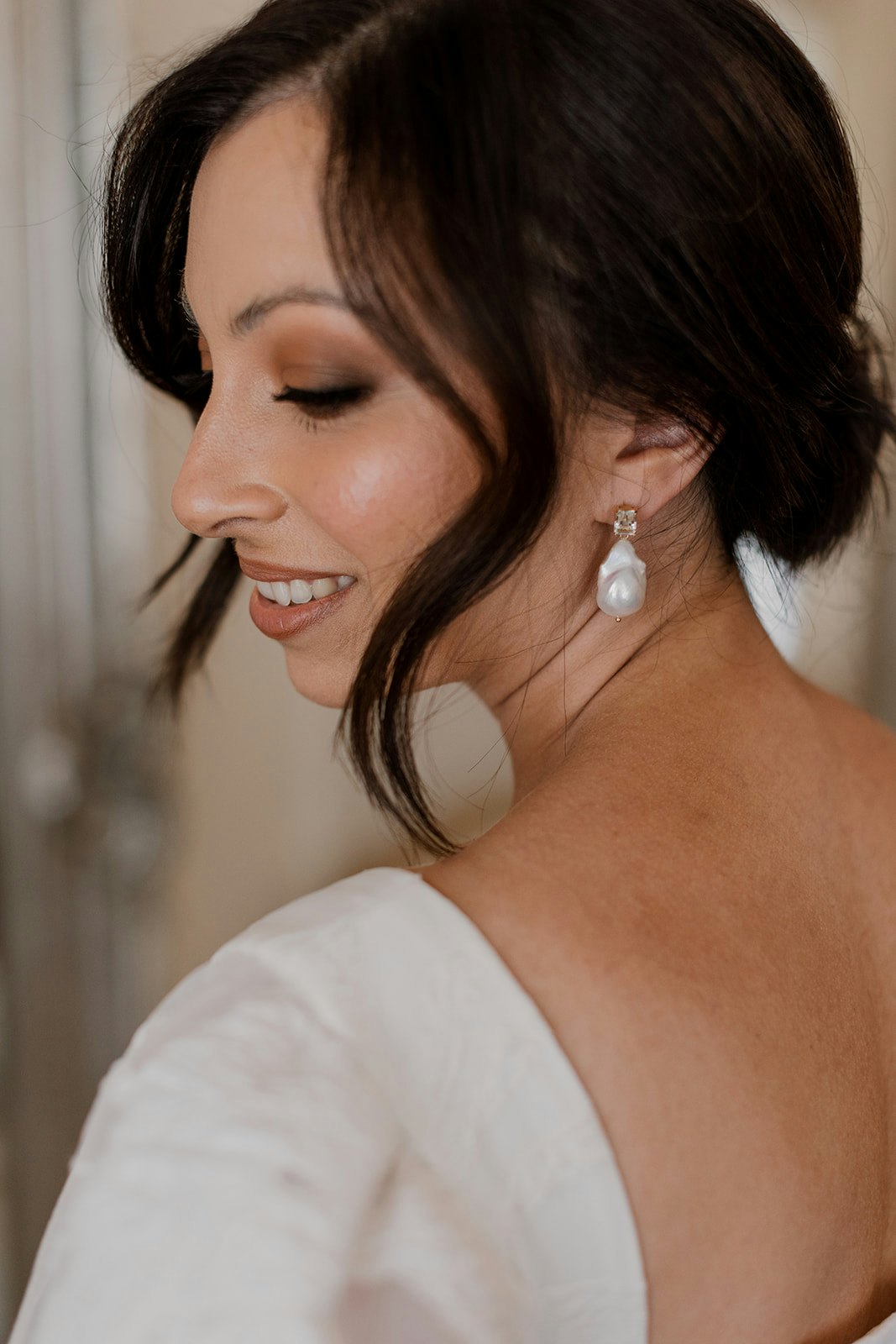 Bride wearing pearl earrings