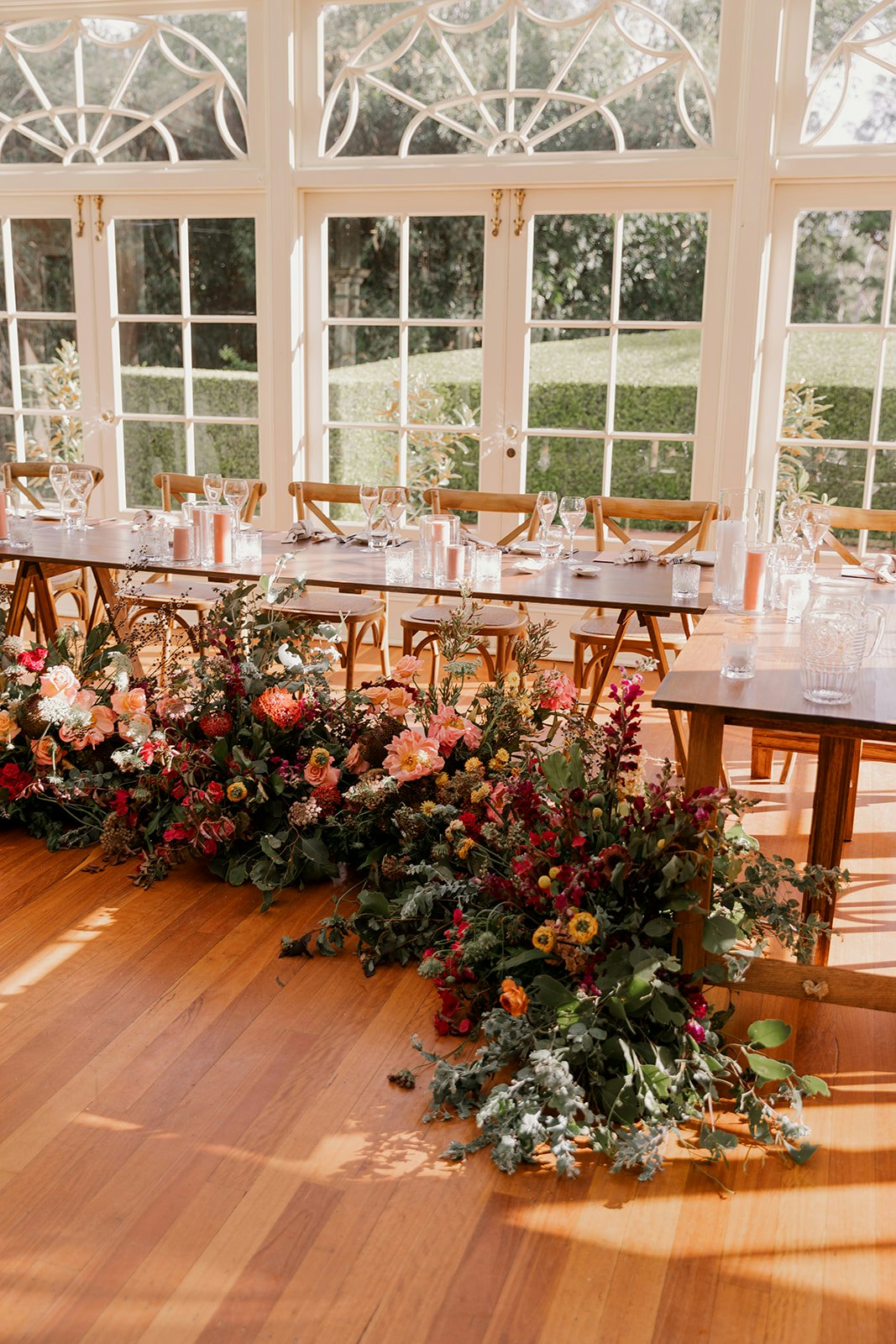 Wedding reception with brightly coloured florals