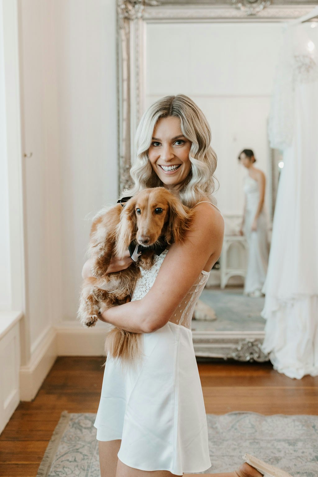 Bride holding dog