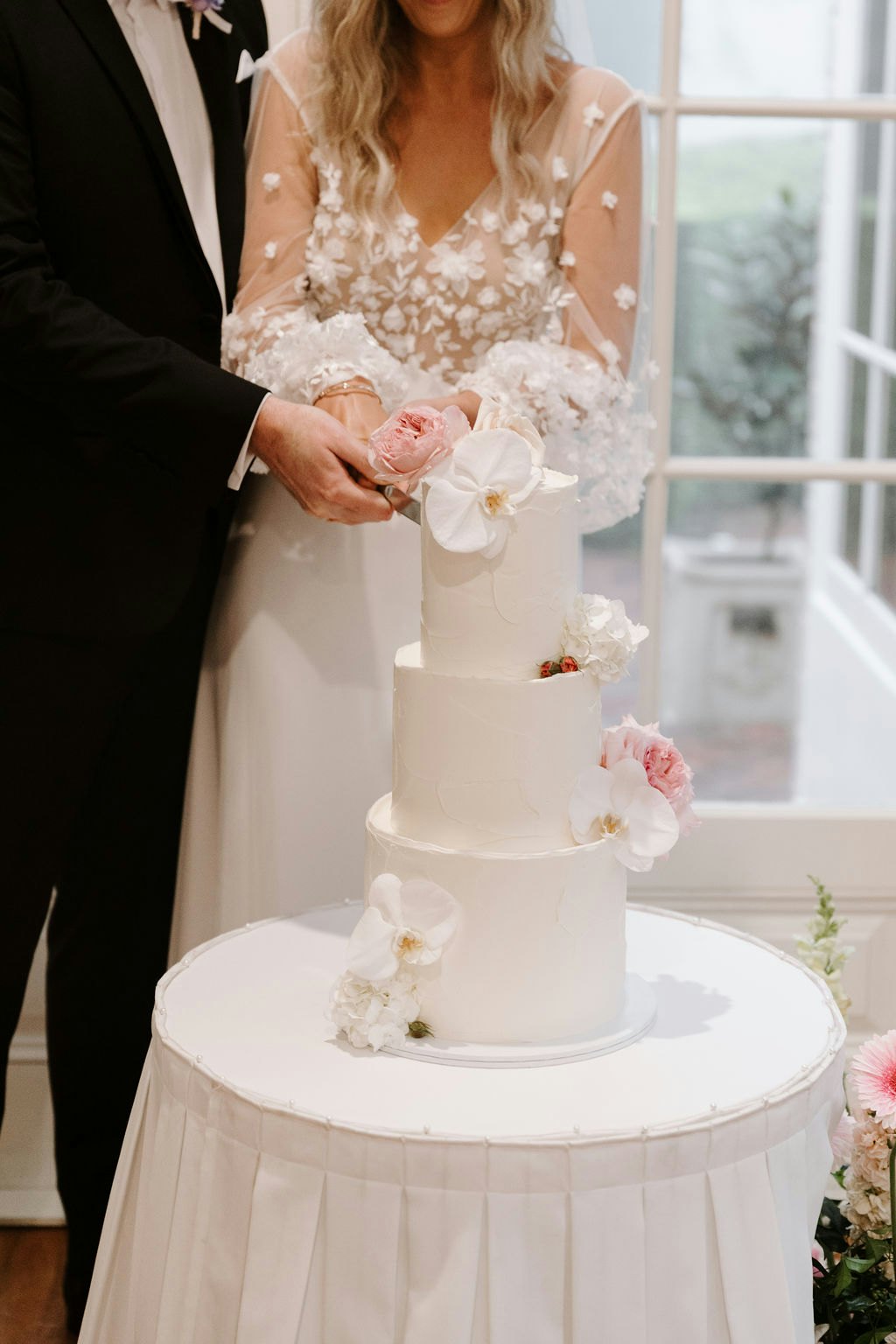 Bride cutting wedding cake