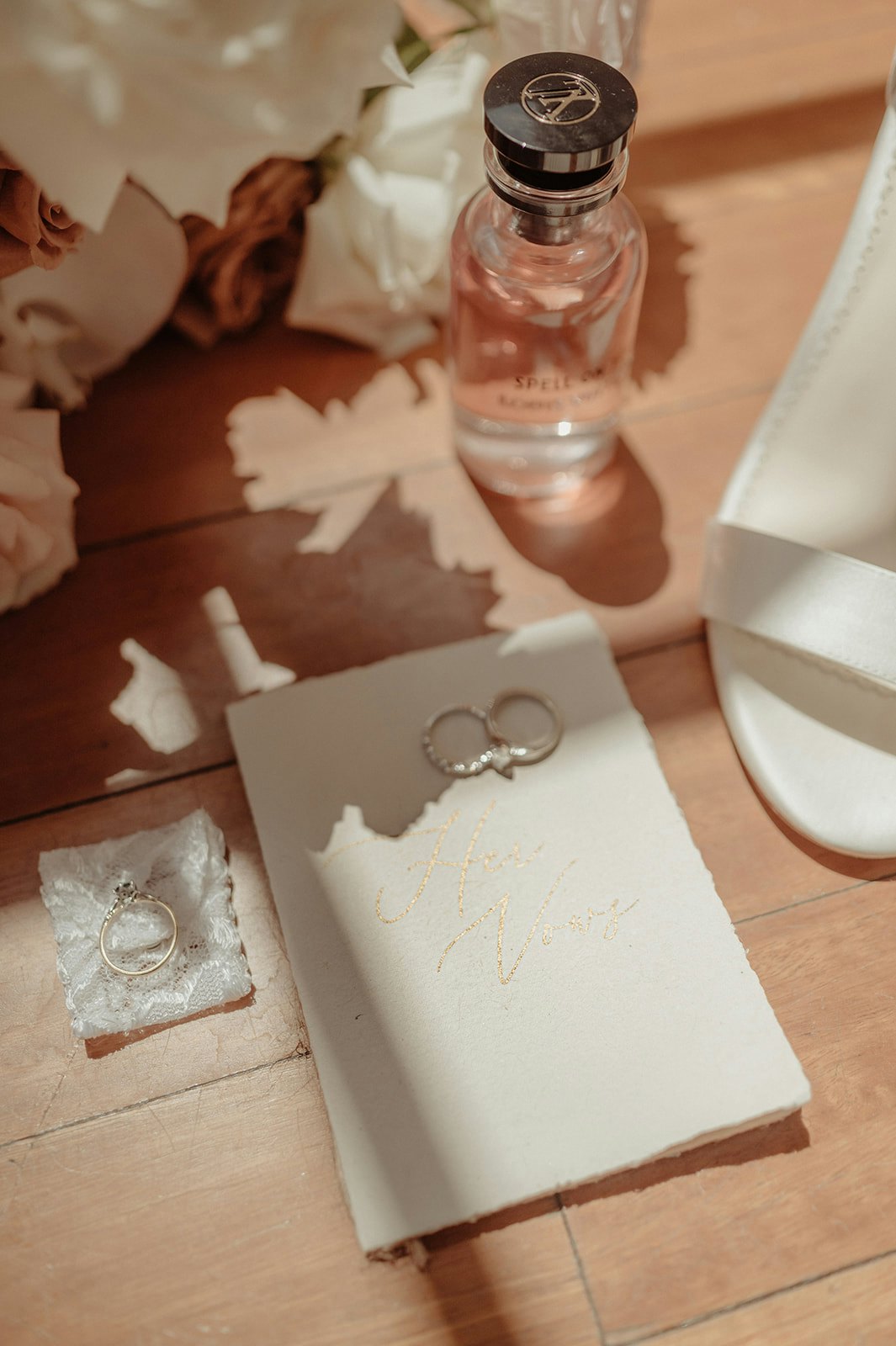 Wedding invitations, rings and flowers