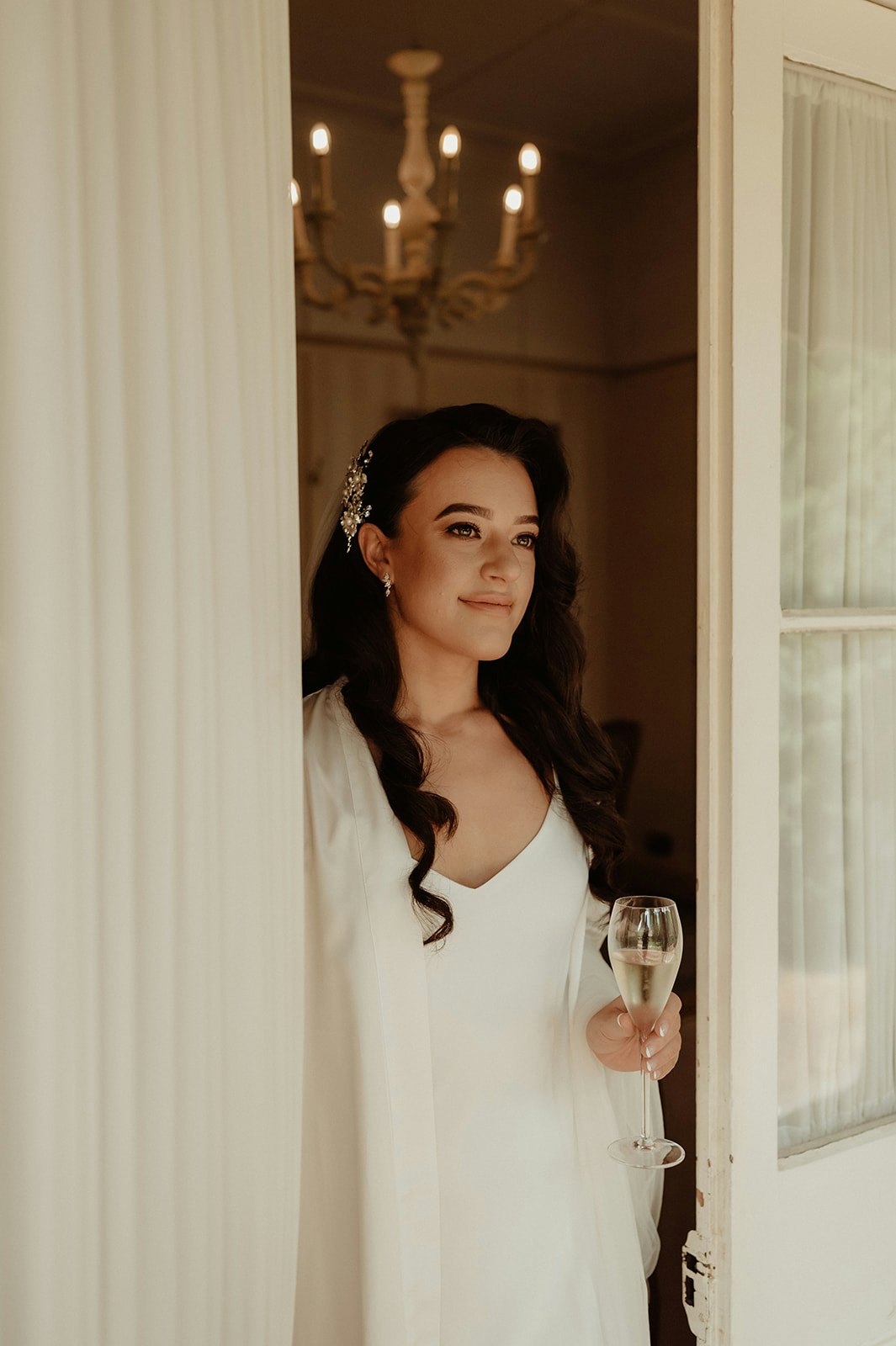 Bride getting ready and drinking champagne