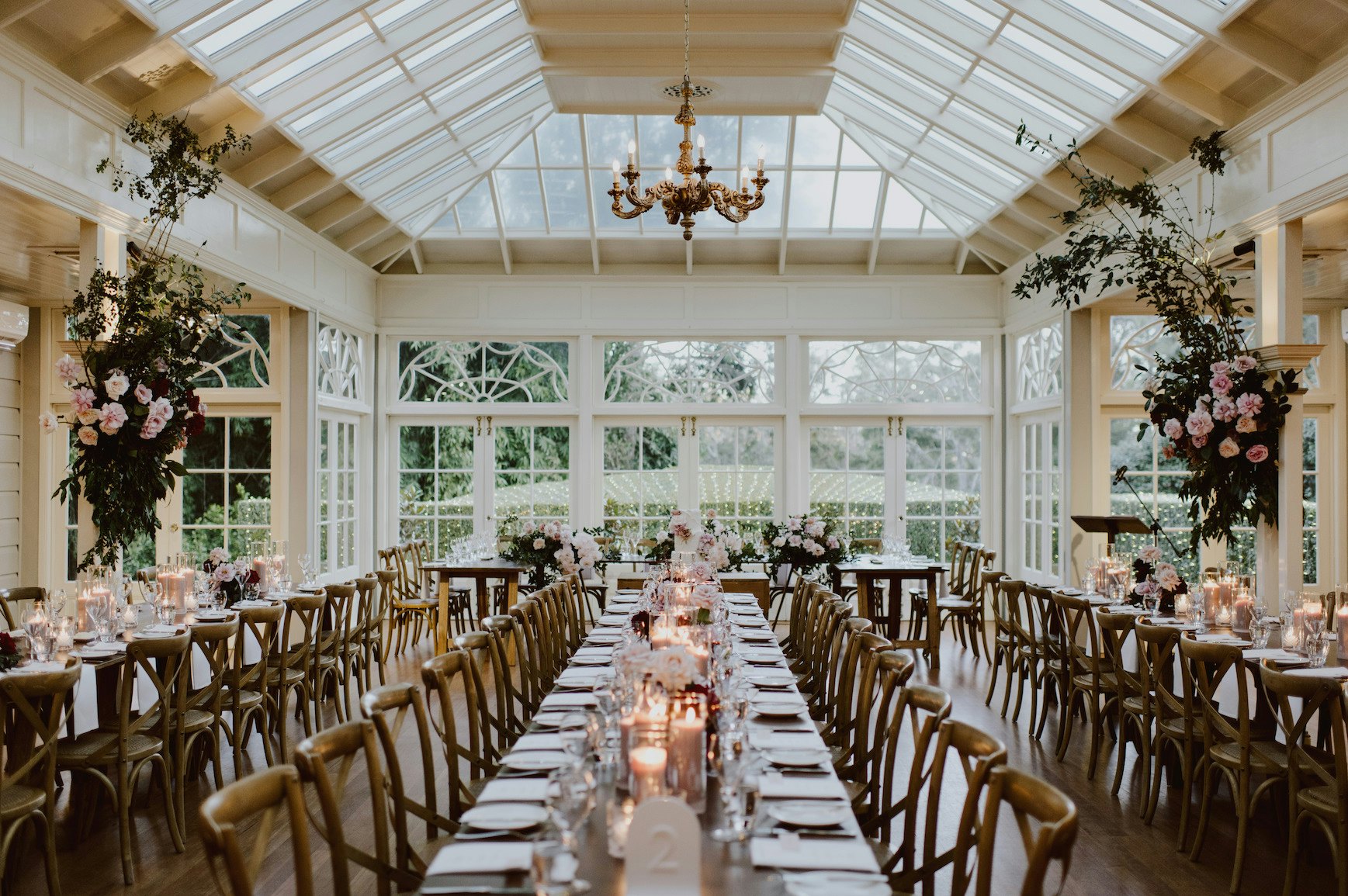 Wedding reception with wooden tables and candlelight