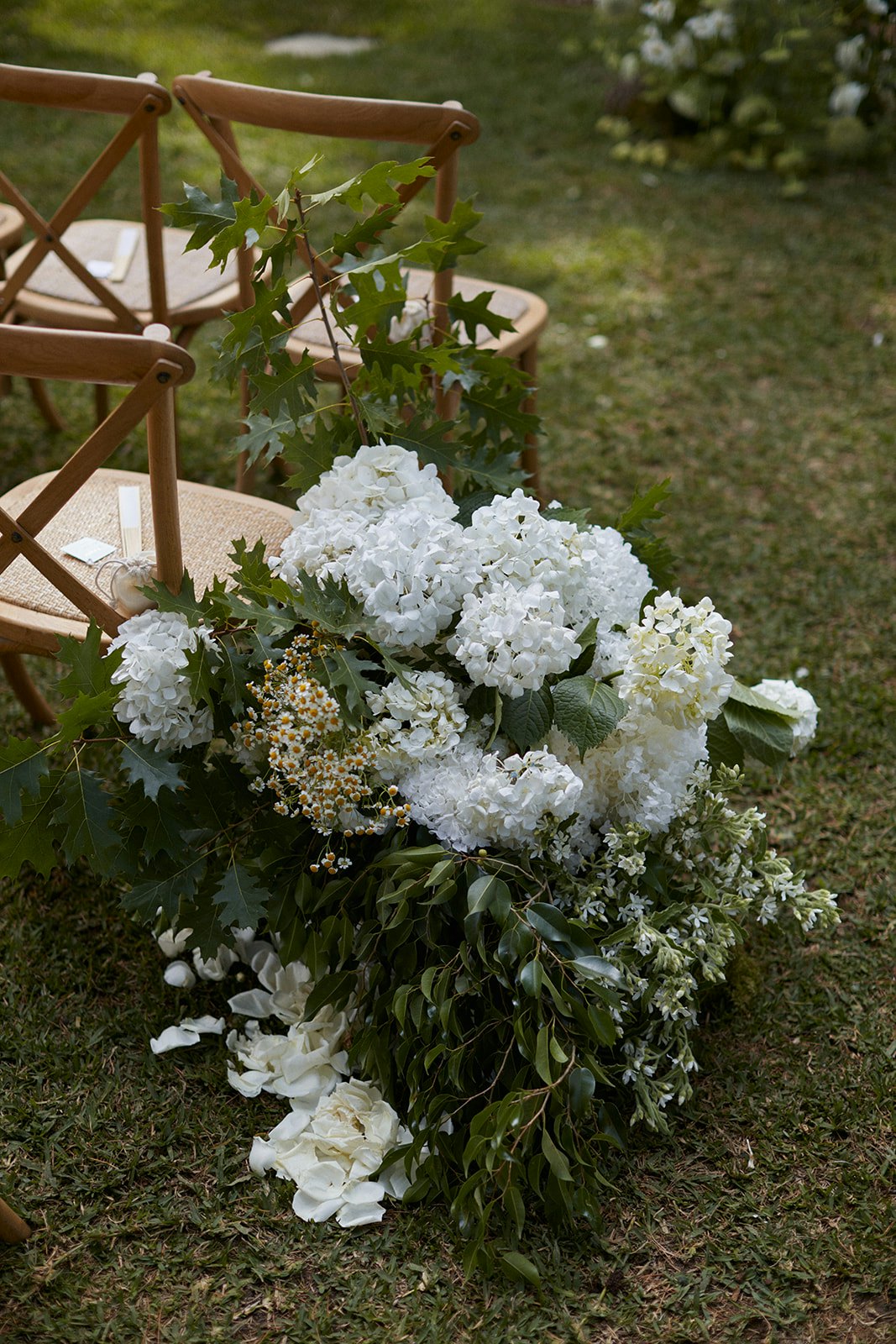 Wedding chairs with flowers by the side