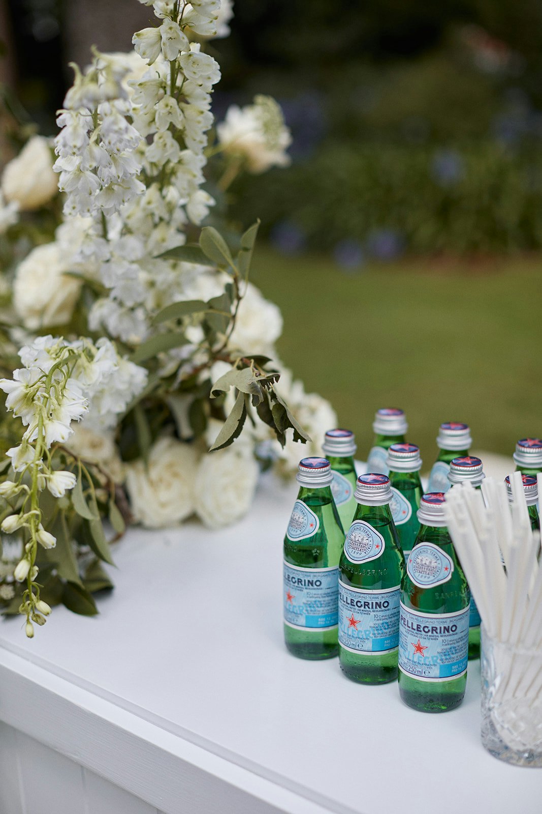 Sparkling water next to flowers