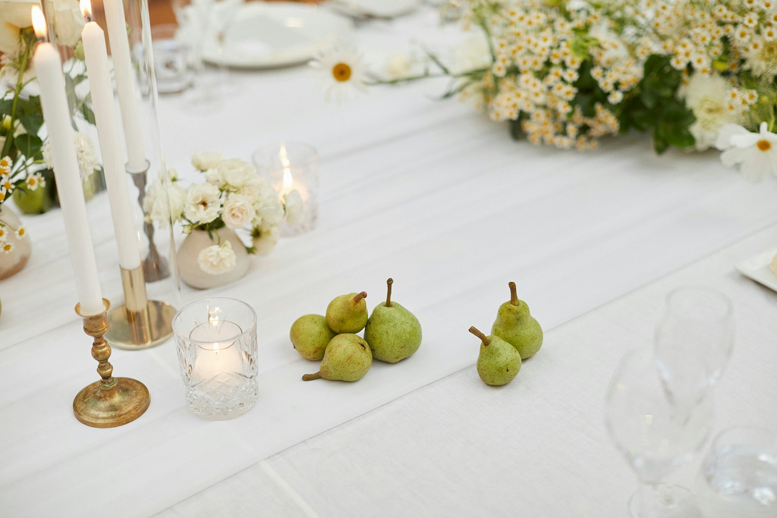 Wedding table with pears on and flowers on it