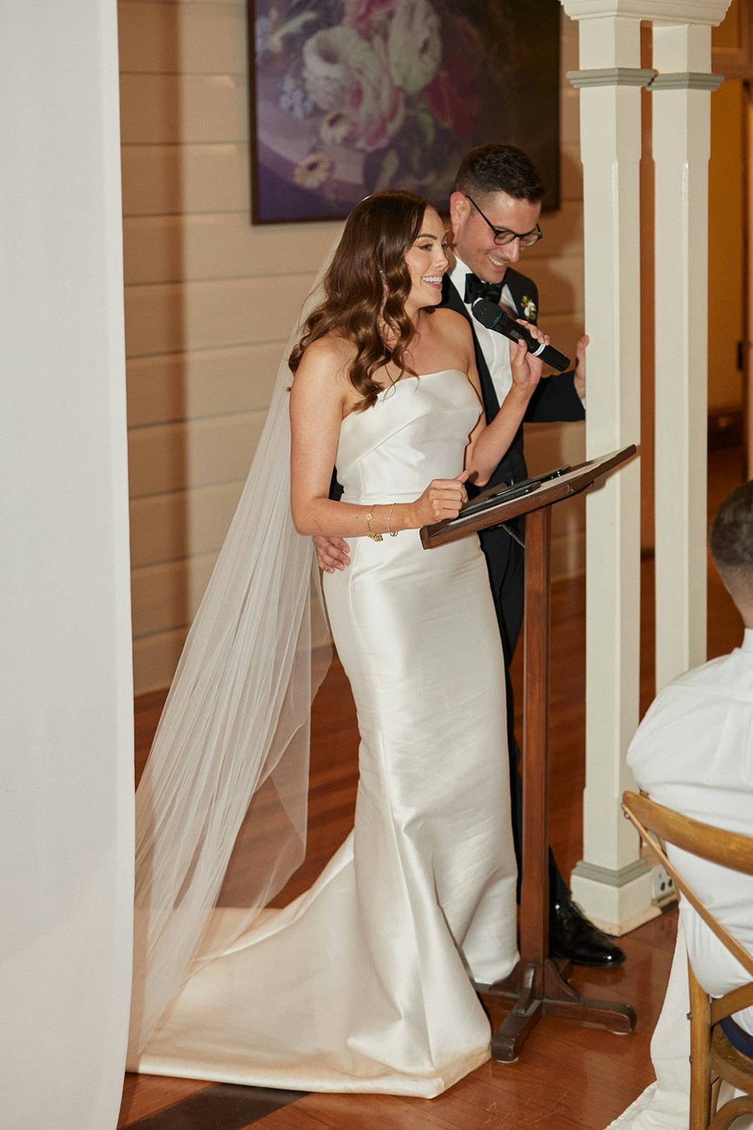 Bride and groom giving speech